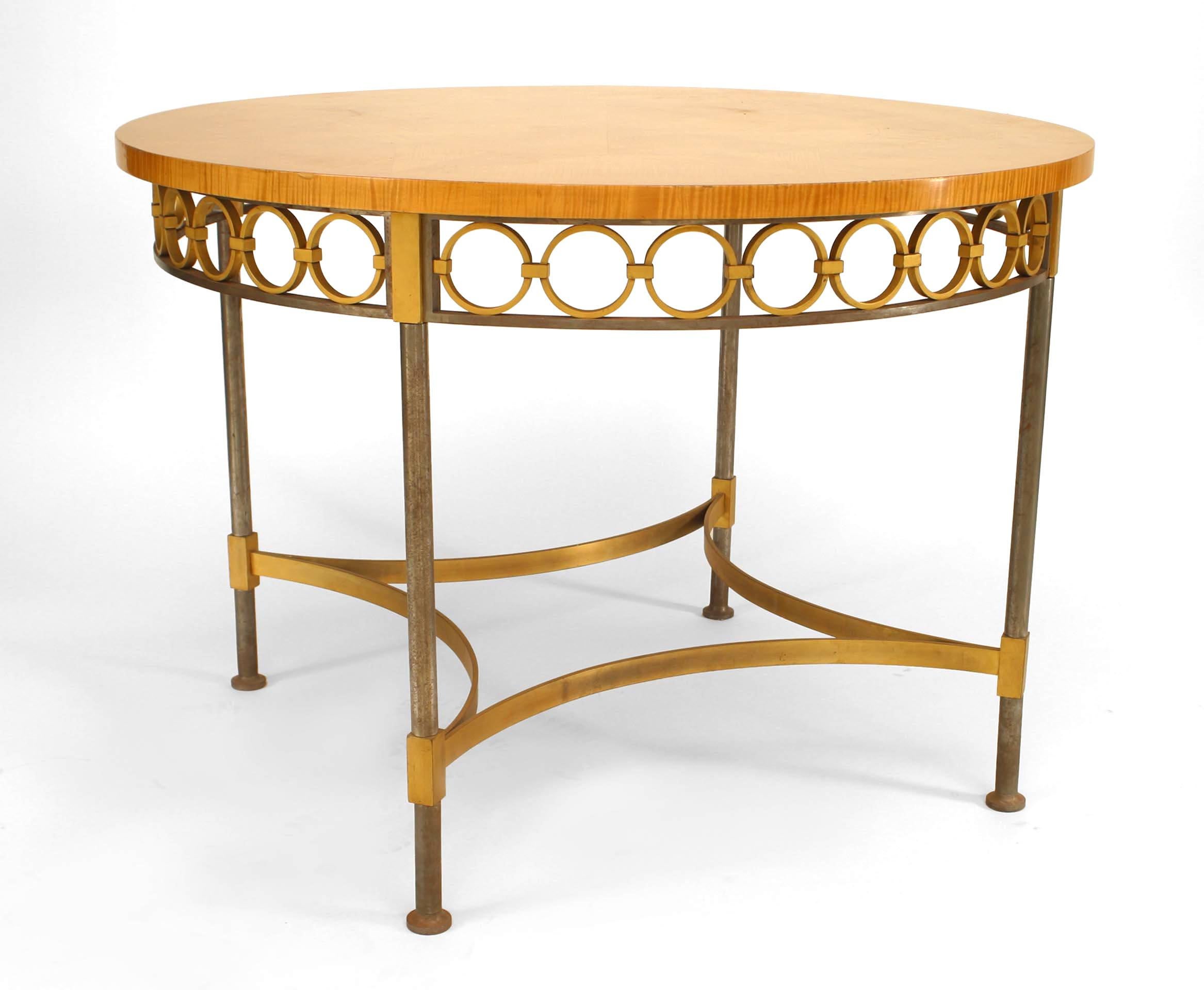 French Mid-Century (1940s) round maple sunburst inlaid top table with steel and brass circular design apron and stretcher. (Attributed to ANDRE ARBUS/RAYMOND SUBES)
