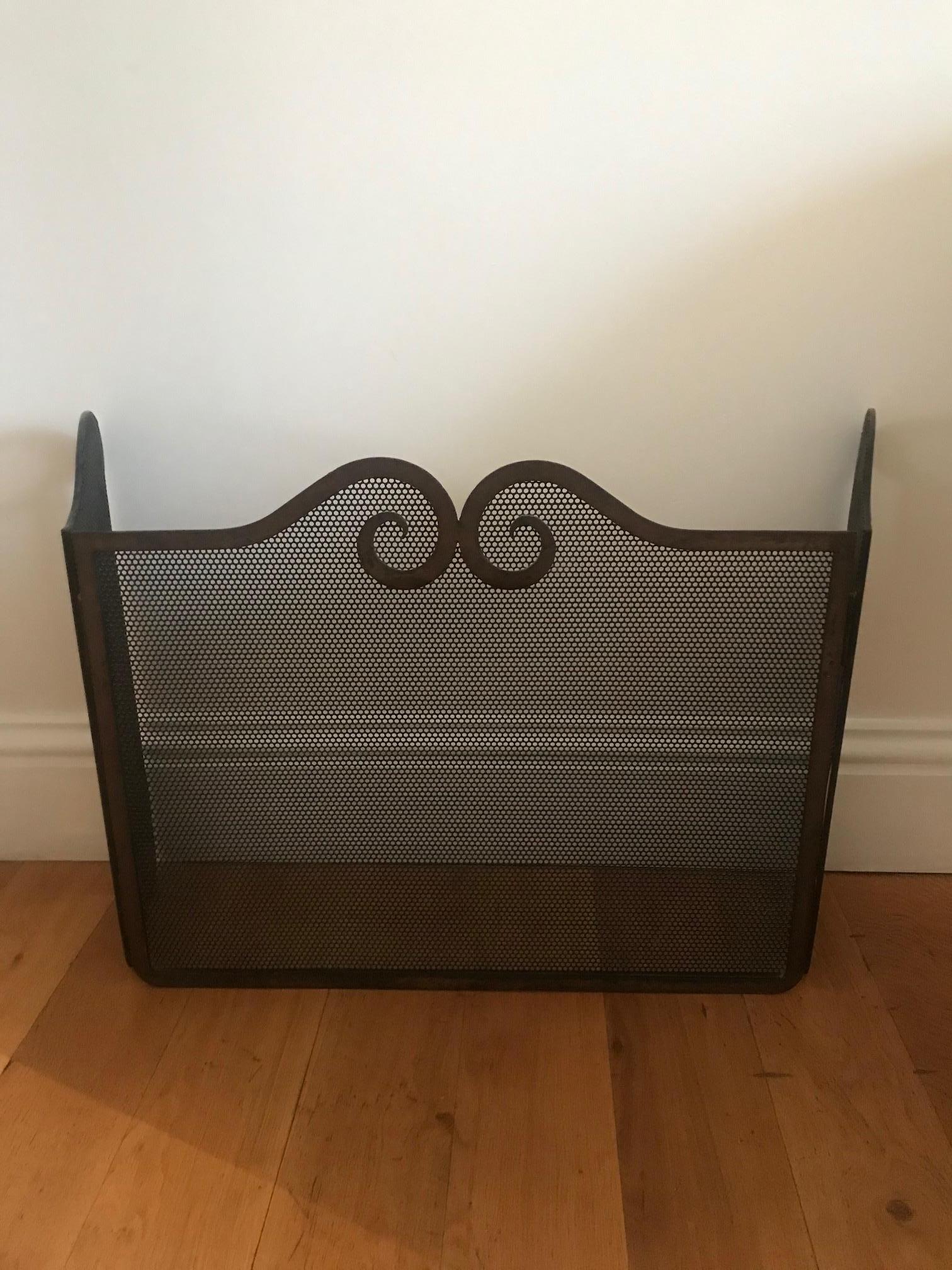 1940s French iron fire screen. Elegant and simple design, would complement most fireplaces.