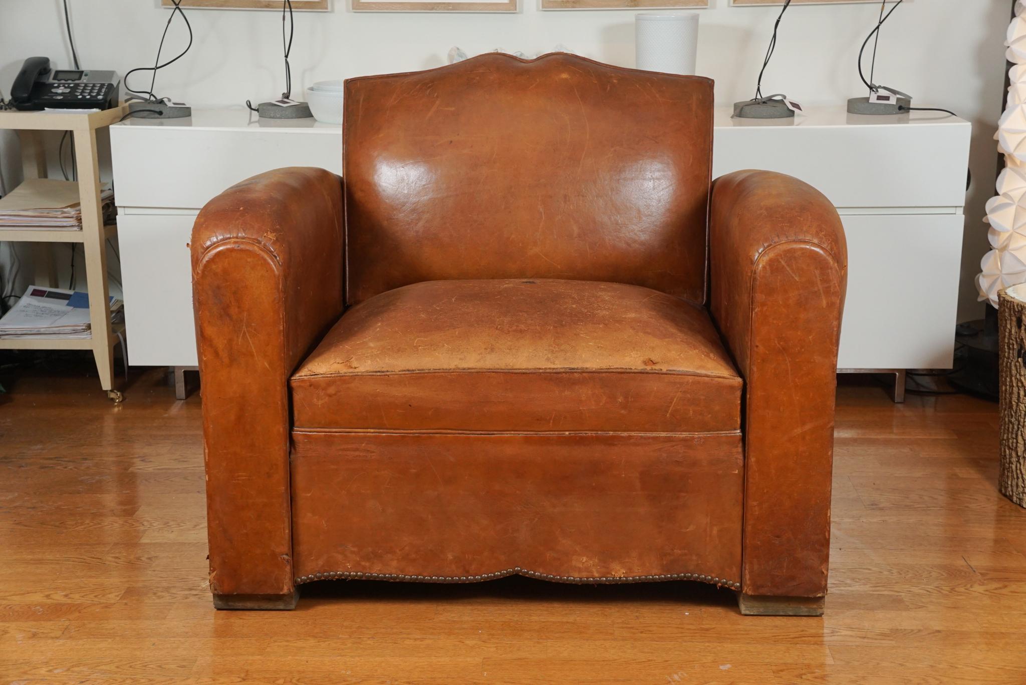 Spectacular, French leather club chair, with a mustache back, that is irresistibly worn, distressed, and completely reeks of the WOW factor! It doesn't stop there... this incredible gem, opens up to a twin size bed! Seriously!! Are you 