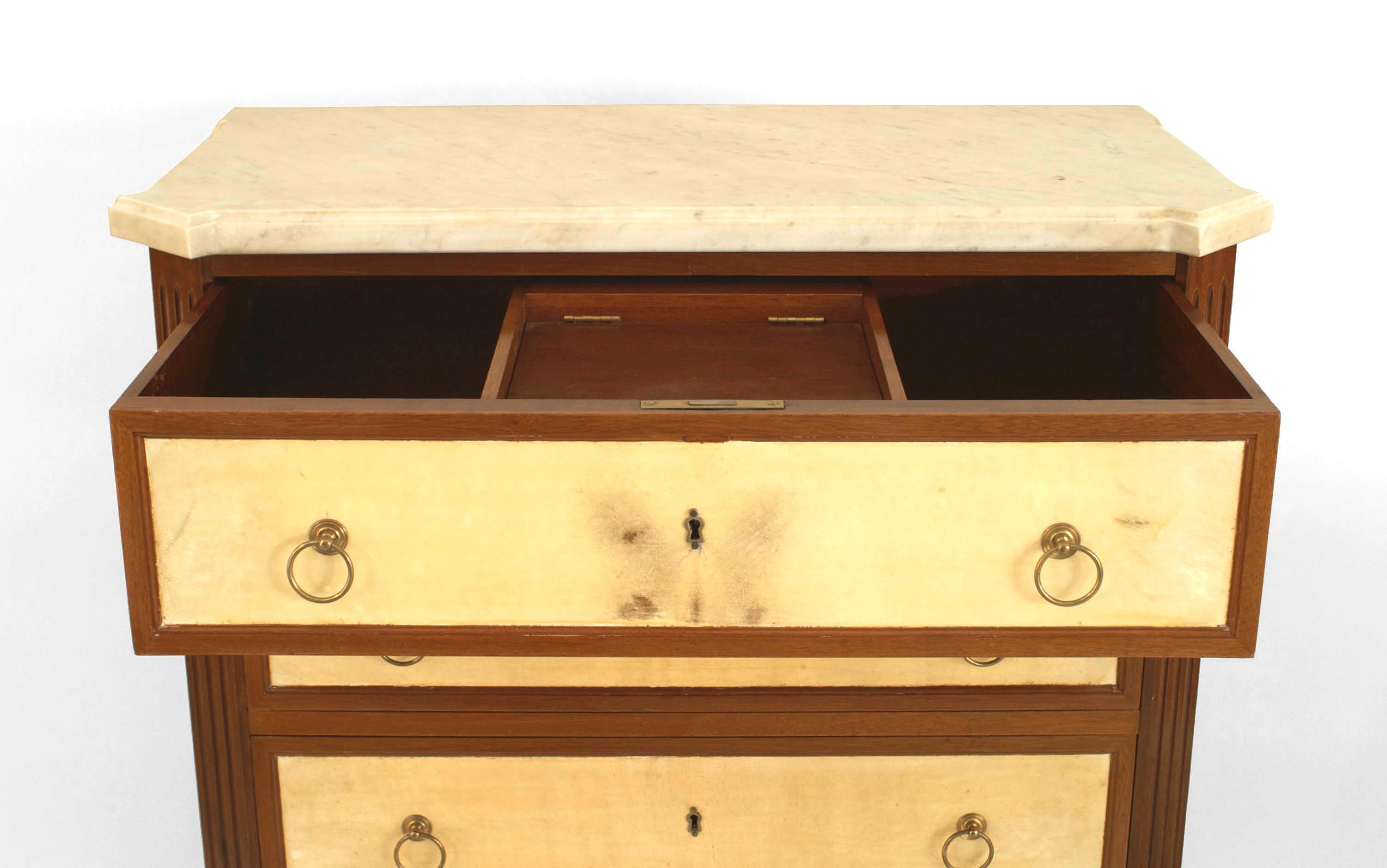 French Louis XVI style (1940s) mahogany chest of 6 drawers having bronze ring handles with parchment veneer and a marble top. (stamped: JANSEN)
