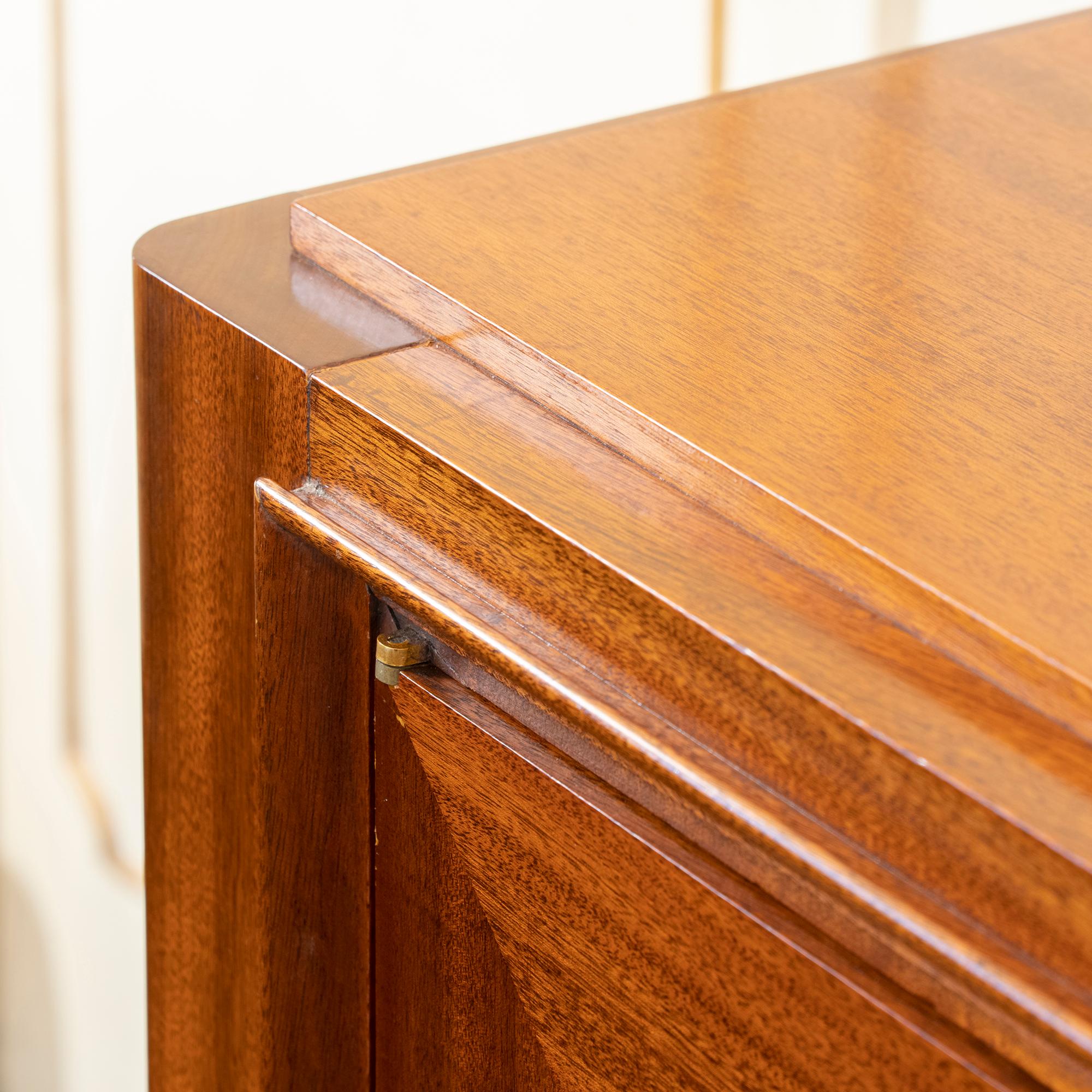 Art Deco mahogany three-door sideboard attributed to Maxime Old with his original marble top. Each door has concentric geometric beading with brass and door locking details, the doors open to reveal fixed shelves, the central section with shelve and