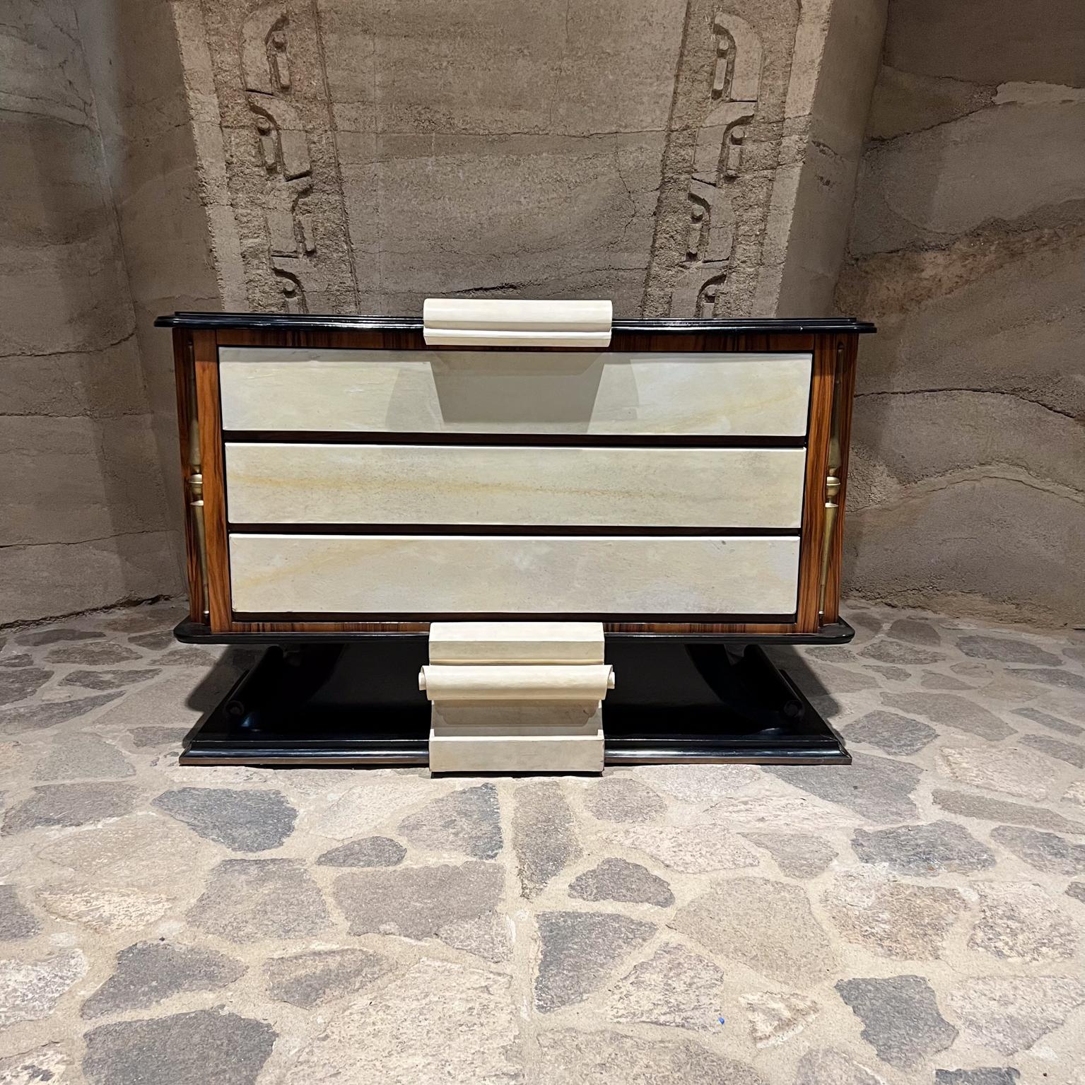 For your consideration, a 1940s French Neoclassical Dresser in Goatskin
Neoclassical Dresser Chest designed by French designers Roberto & Mito Block
Goatskin, rosewood, mahogany, parchment & bronze.
Bronze side pillar accent
Dramatic and fabulous