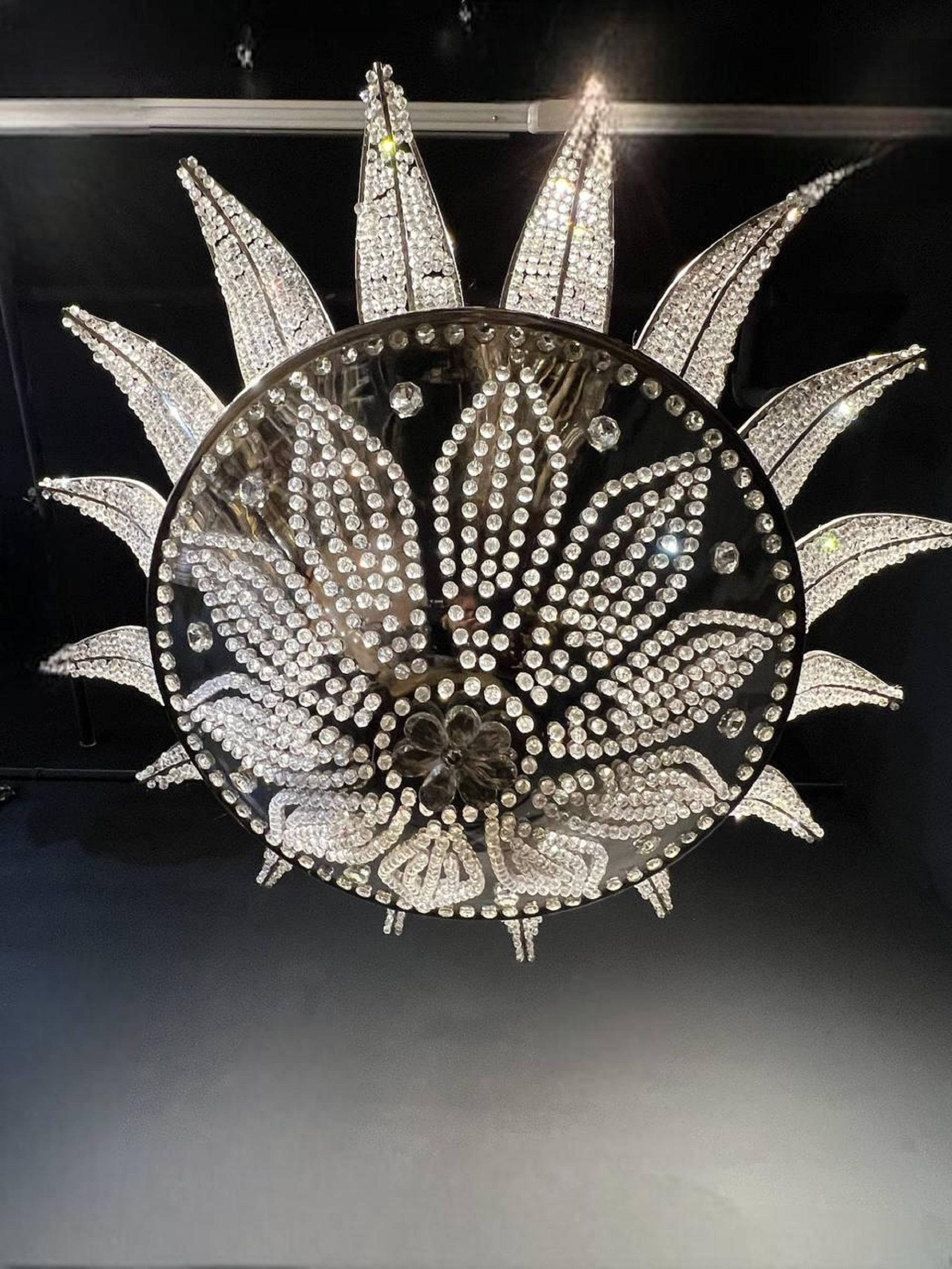 A circa 1940’s French nickel plated light fixture with beaded crystals (12 interior lights) 