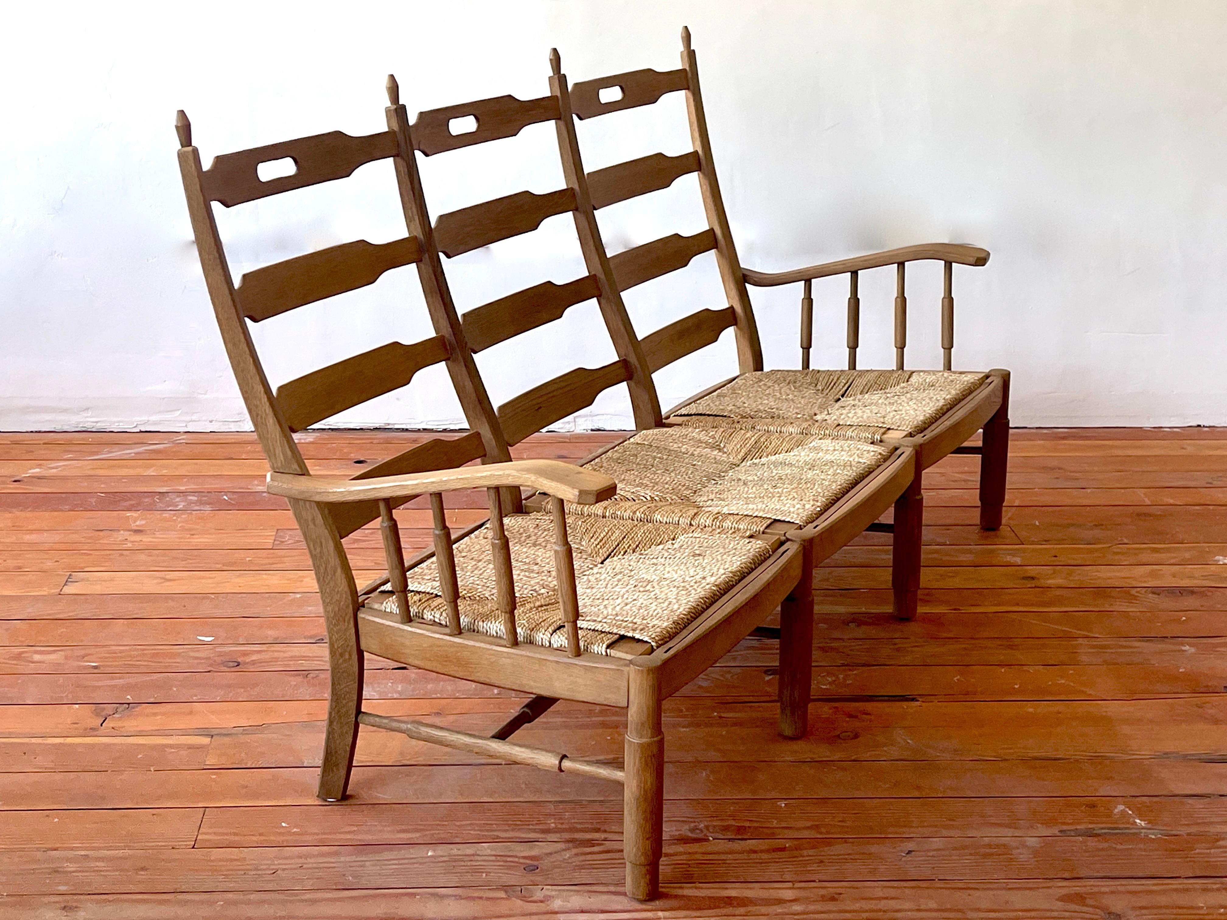 Wonderful French oak bench - France circa 1940's 

Curved back with spindles and new rush seats 

Great patina to wood!