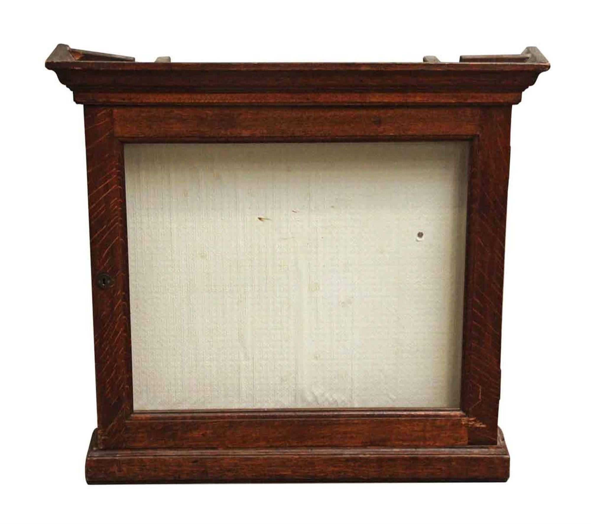 1940s French dark wood tone oak display case with key. This can be seen at our 400 Gilligan St location in Scranton, PA.