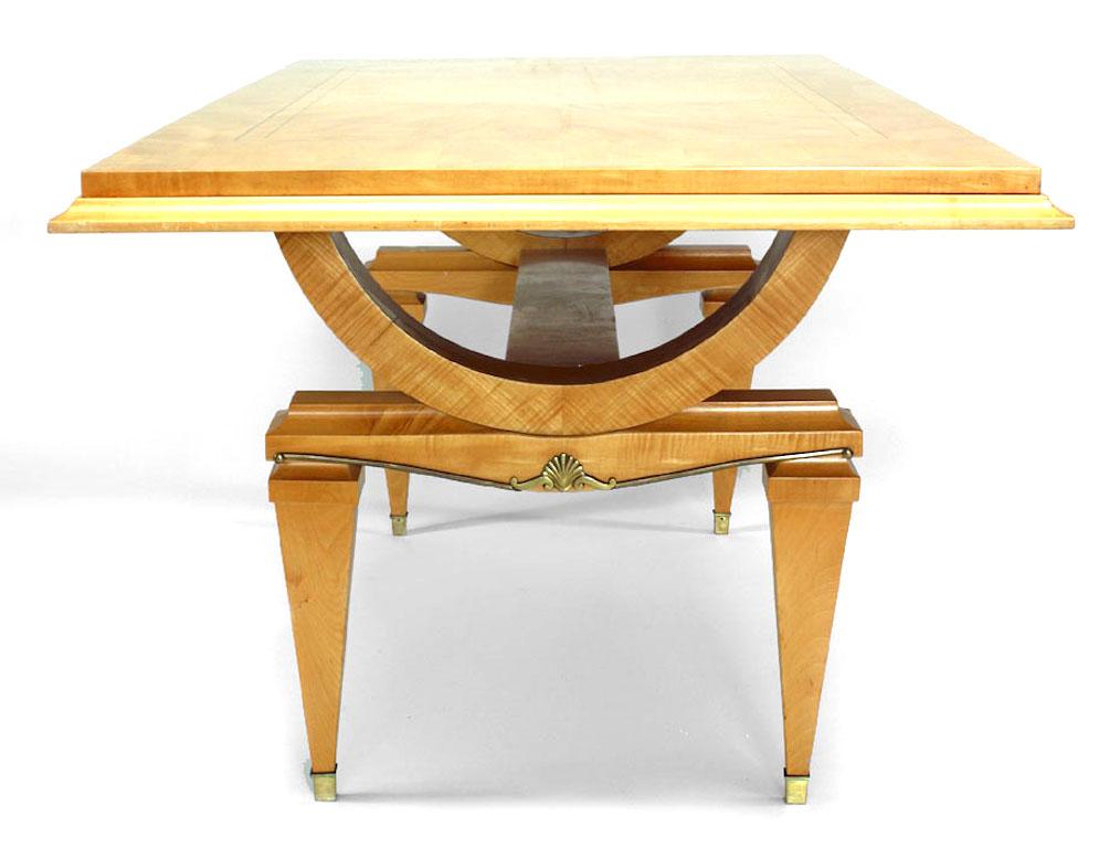 French Mid-Century (1940s) ormolu mounted sycamore extending dining table on X form legs with stretcher and the top inlaid with starburst design. (Attributed to ANDRE ARBUS)
