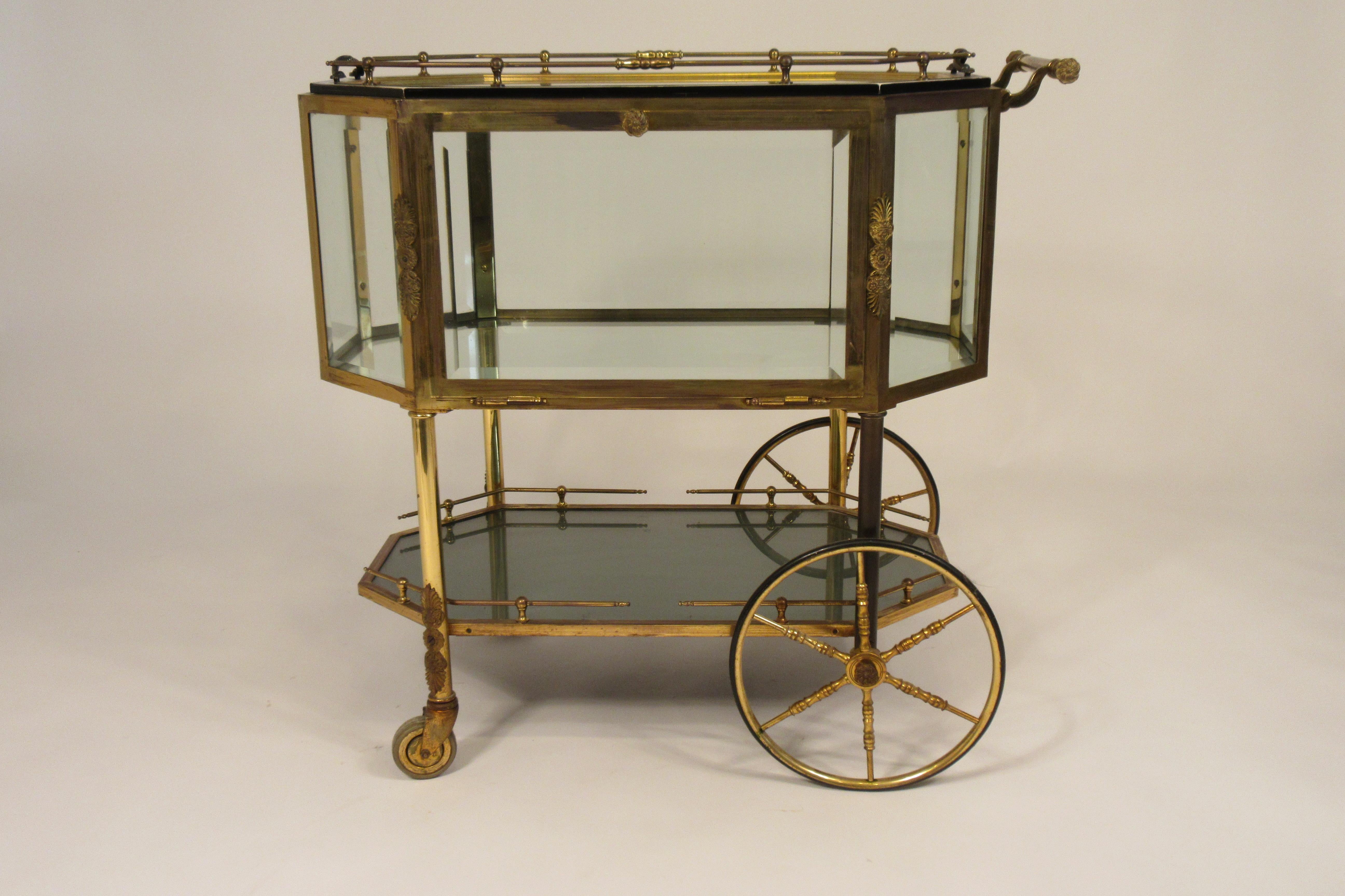 1940s French pastry / bar cart. Brass and beveled glass. Glass door opens to allow access. Out of a NYC penthouse apartment.