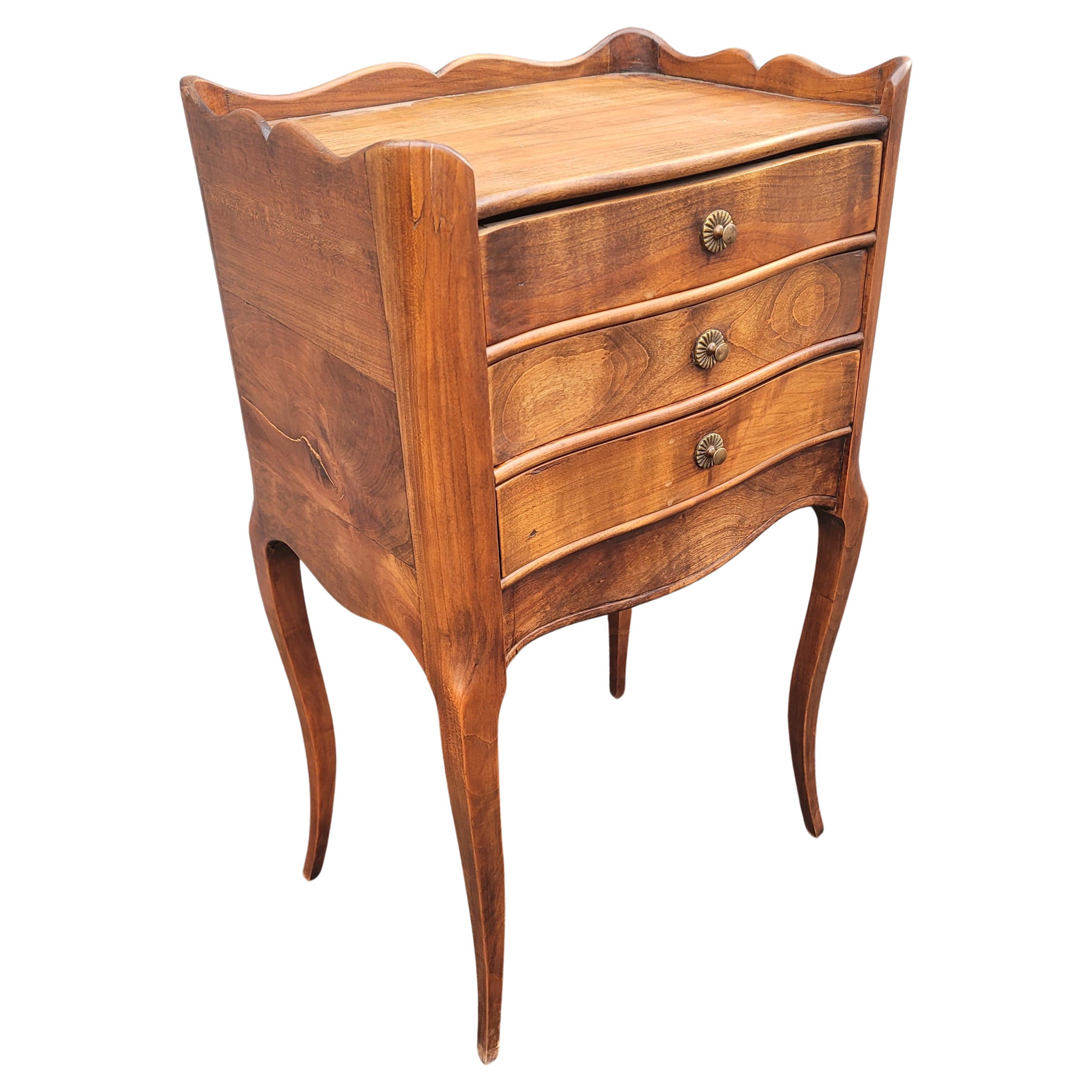 
Recently refinished 1940s French Walnut Three-Drawer Bedside Table or Nightstand
Measures 15.5
