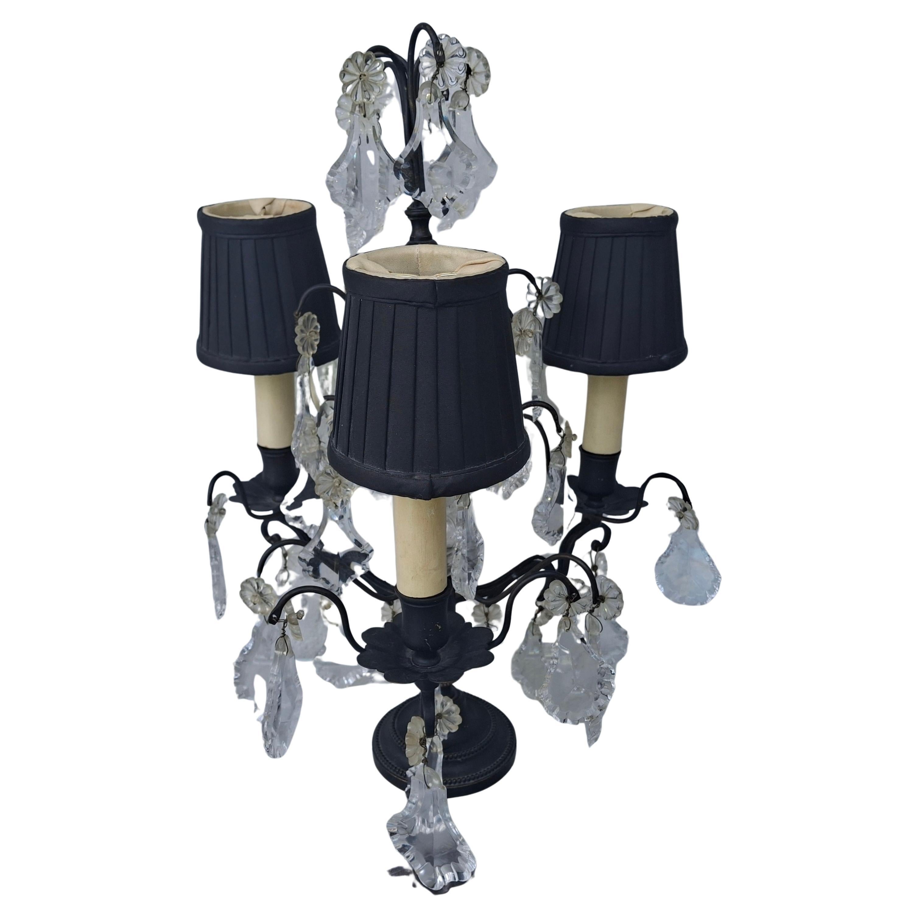 1940's French Regency / Louis XV style Black Patinated Bronze with Cut Crystal Table Lamp/ Electrified Girandole. 3 lights, high quality crystal and made by Baccarat. Black silk shades included. This lamp was purchased in the 1960's by previous