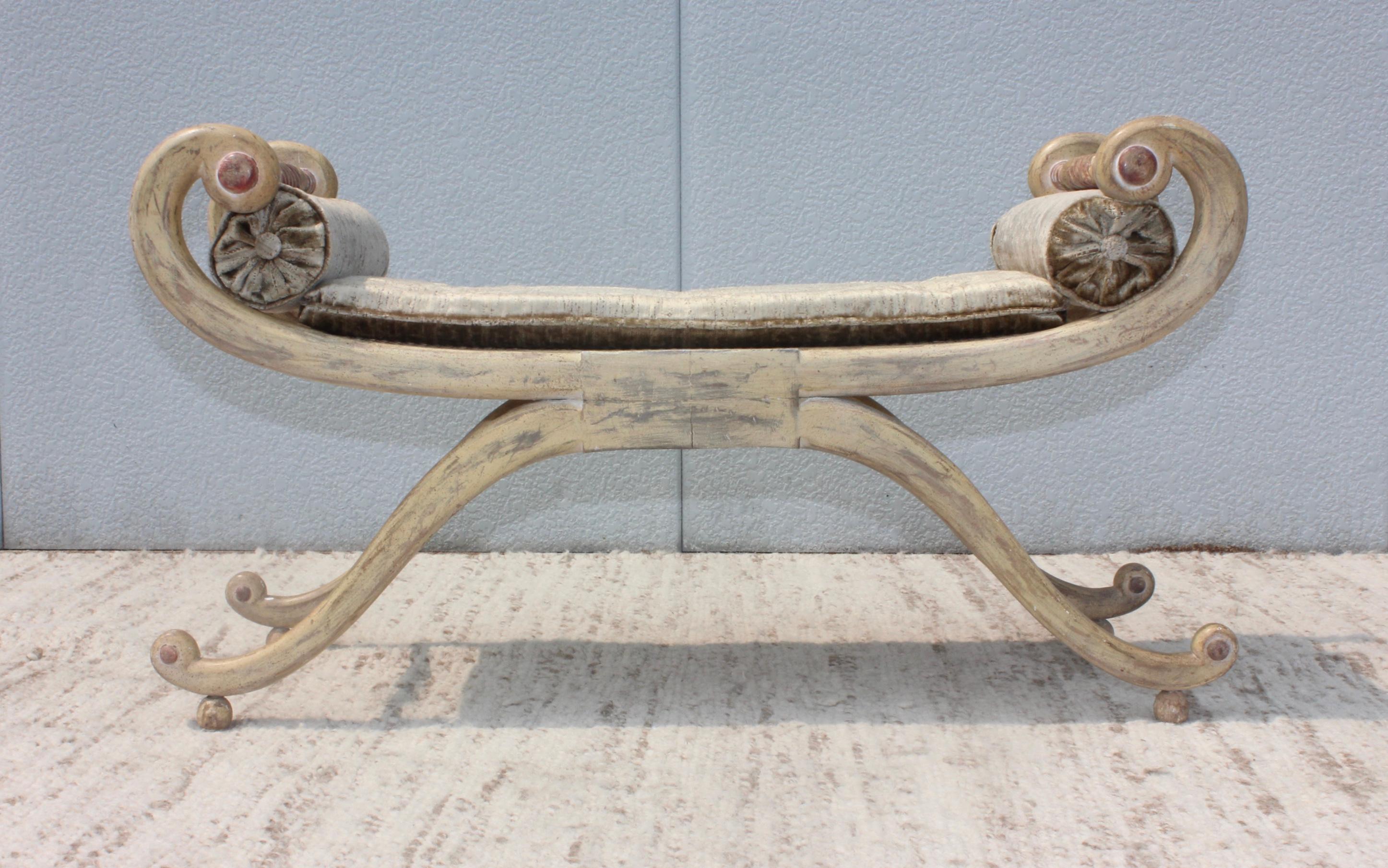 1940s French scroll arm bench in original distressed finish with velvet upholstery.