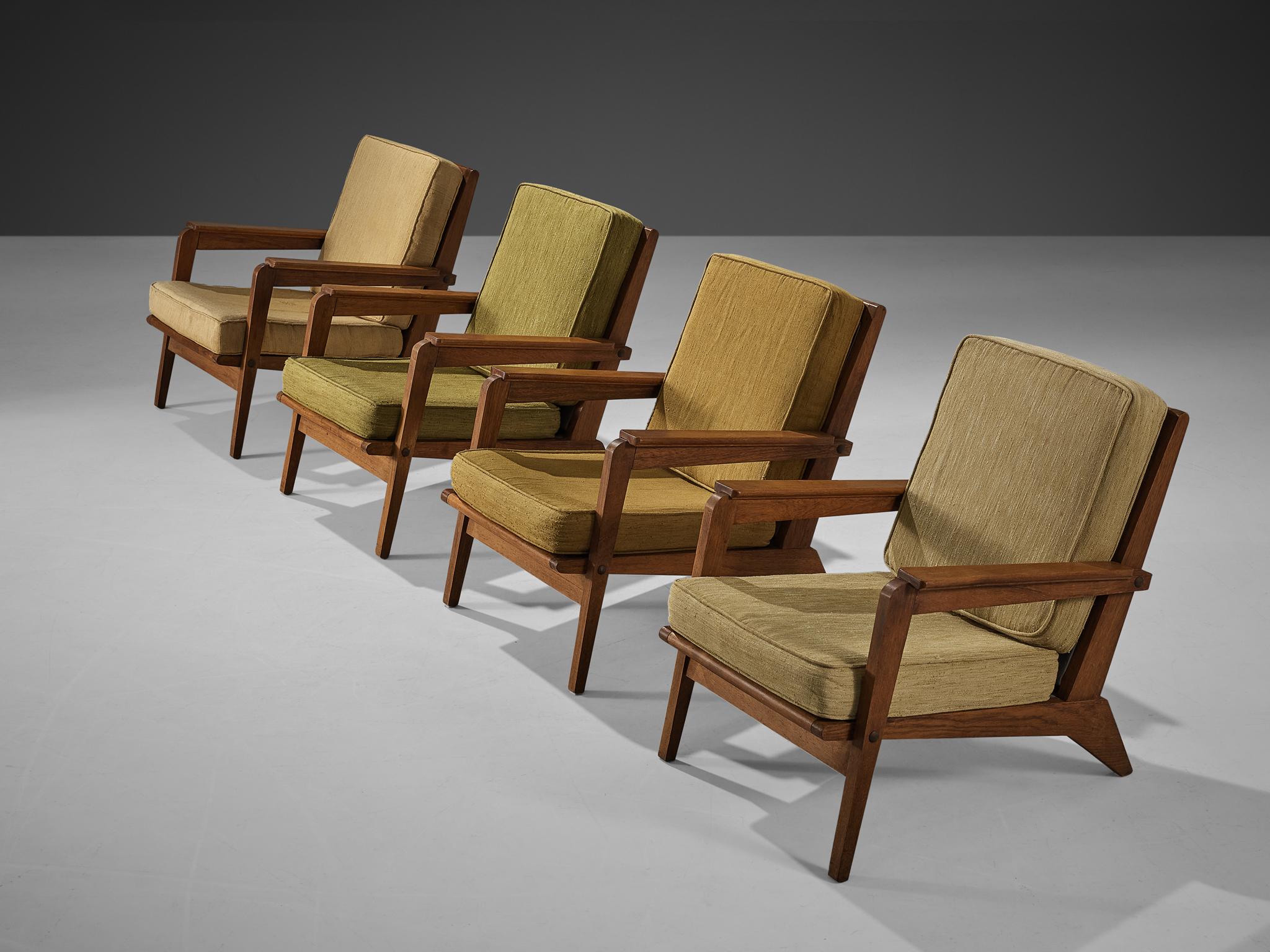Set of four lounge chairs, fabric, wood, France, 1940s. 

These armchairs strongly remind of the iconic chairs created by the talented French designer René Gabriel (1899-1950), who is known for his constructivist approach to furniture design. The