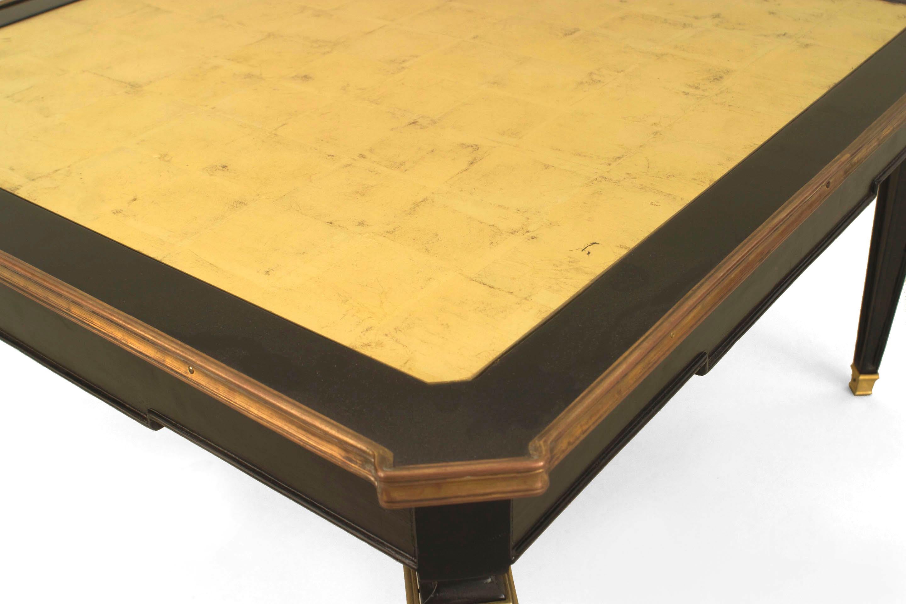 2 French Mid-Century (1940s) ebonized square coffee tables with a gilt bronze rim and trim with a gold leaf inset top and tapered square legs. (MAISON JANSEN) (PRICED EACH)
