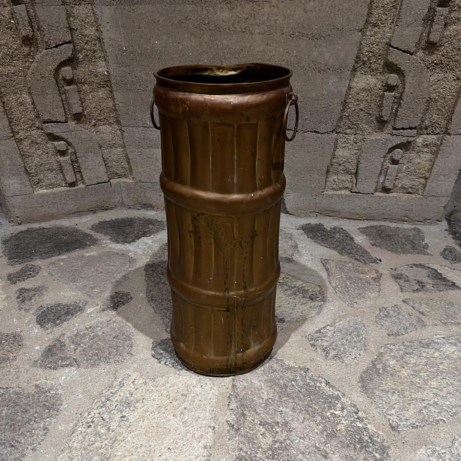 1940s French Umbrella Stand Solid Brass Faux Bamboo France
Crafted in Solid Brass with vintage patina.
Faux bamboo brass ring holder at side.
In the manner of Mathieu Matégot.
No markings
19.5 h x 7.75 diameter x 9 w
Original fair vintage unrestored