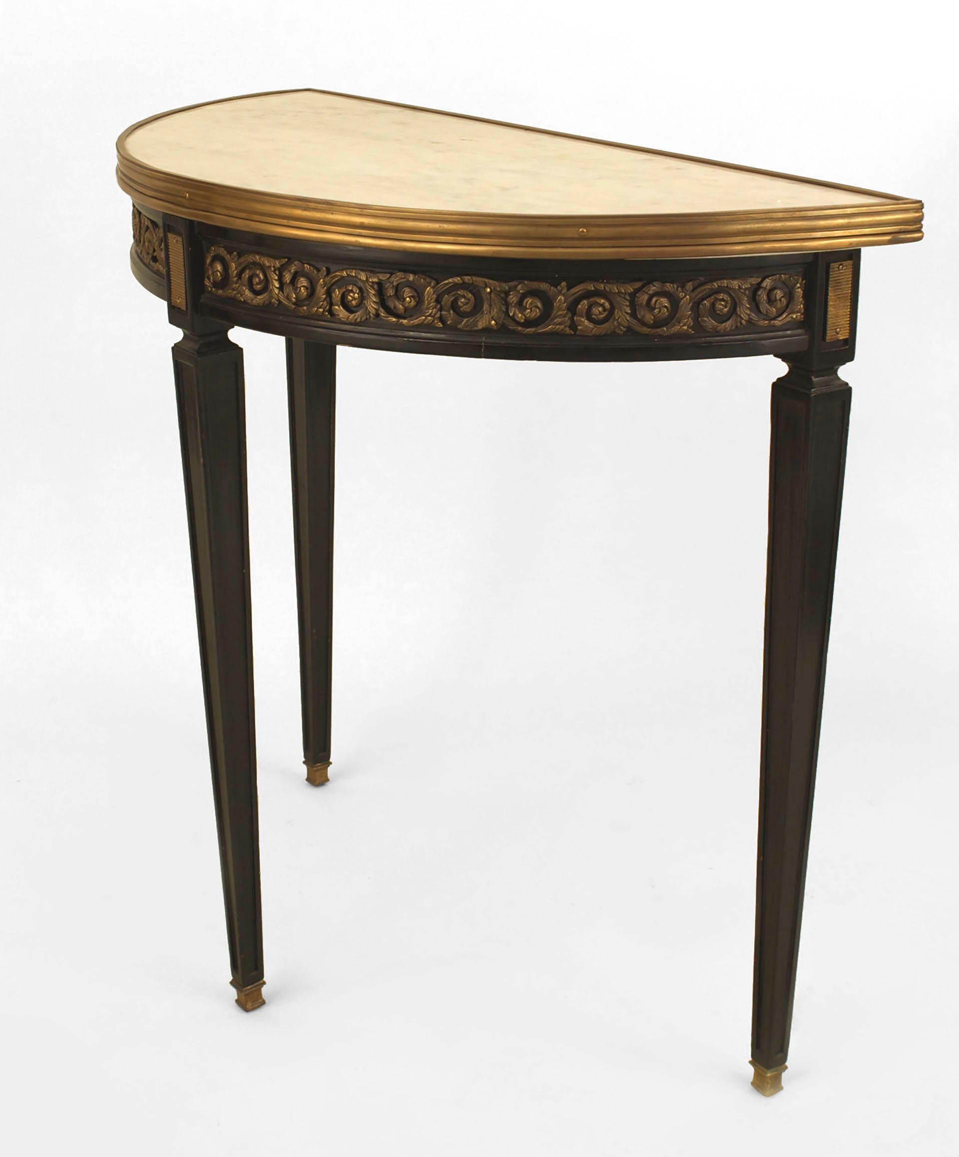 French Louis XVI-style (1940s) ebonized demilune shaped console table with a bronze trimmed scroll design apron and top edge with an inset white marble top. (stamped: JANSEN)

