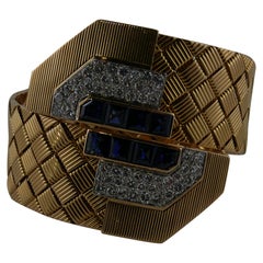 1940s French Yellow Gold Natural Sapphires and Diamonds Cross-Over Bangle 1940s French Yellow Gold Natural Sapphires and Diamonds Cross-Over Bangle