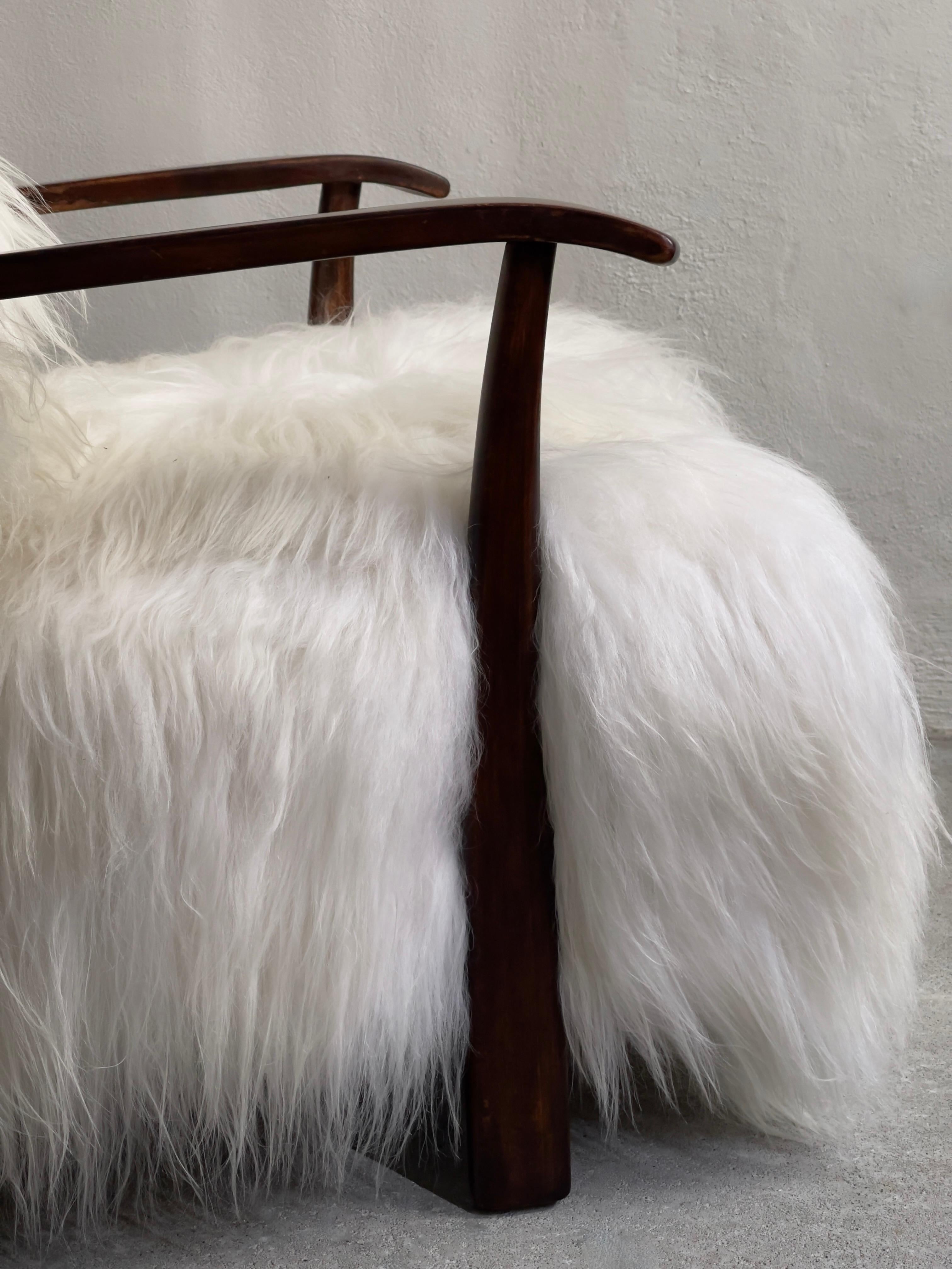 Scandinavian Modern 1940s Fritz Hansen Easy Chair Reupholstered in long haired Icelandic Sheepskin. For Sale
