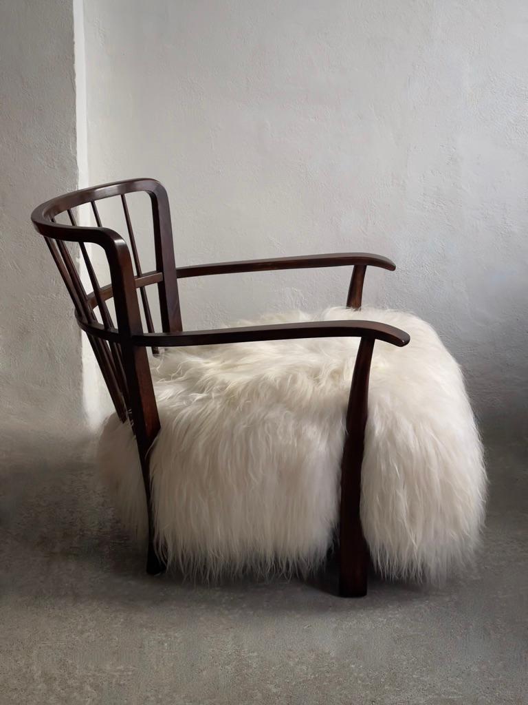 Danish 1940s Fritz Hansen Easy Chair Reupholstered in long haired Icelandic Sheepskin. For Sale