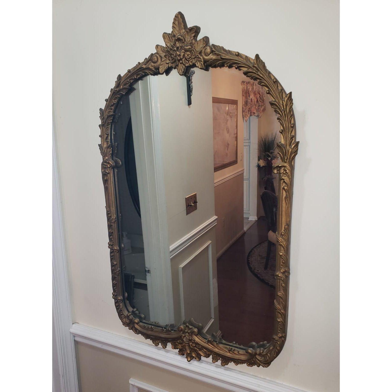 Real giltwood ornate mirror from the 1940s. Mirror shows signs of aging appropriate with actual age.
Measures: 22W x 34H.