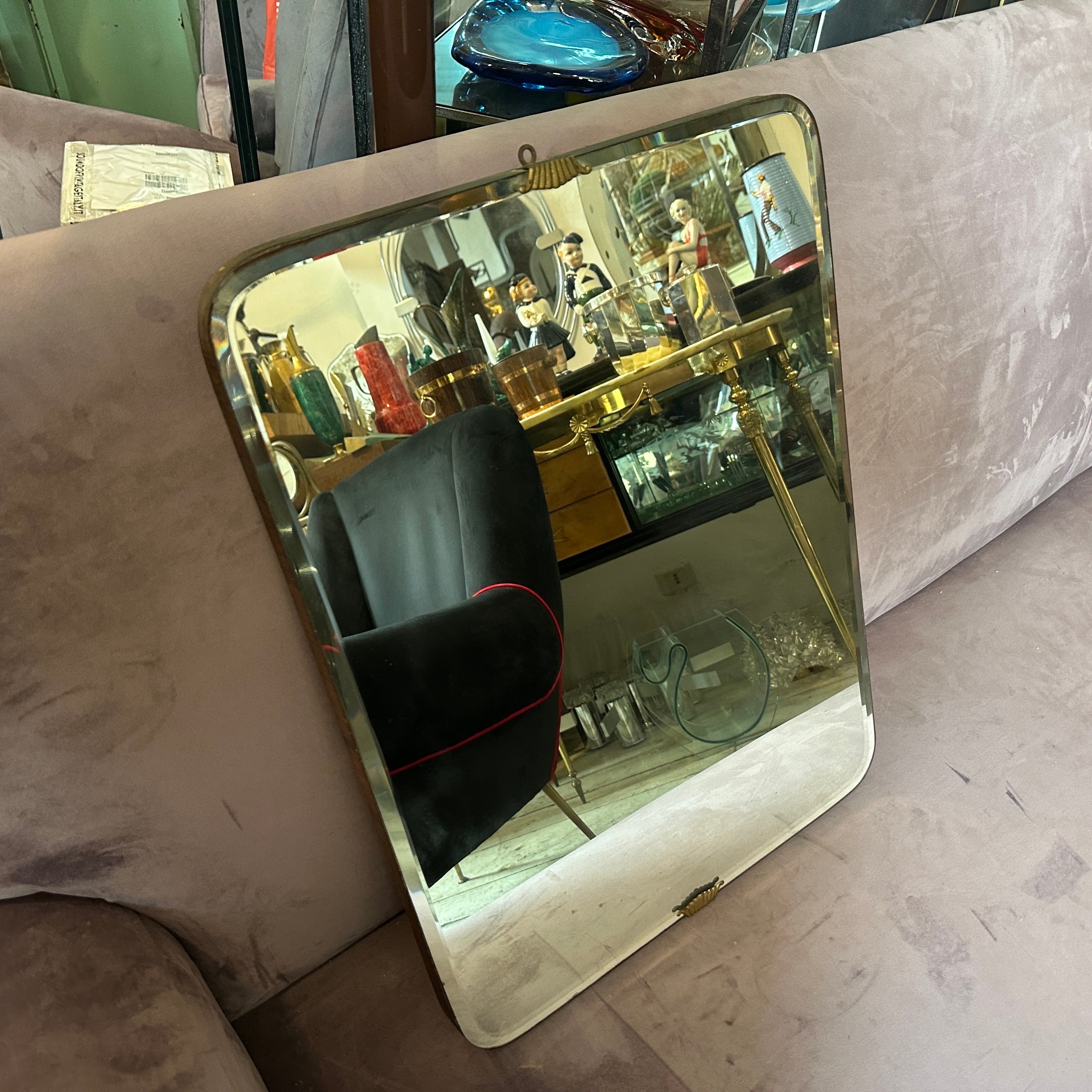 This Italian Wall Mirror exemplifies the opulence, sophistication, and geometric elegance characteristic of the Art Deco movement. It's in original condition with signs of use and age. This mirror features a rectangular shape, a hallmark of Gio