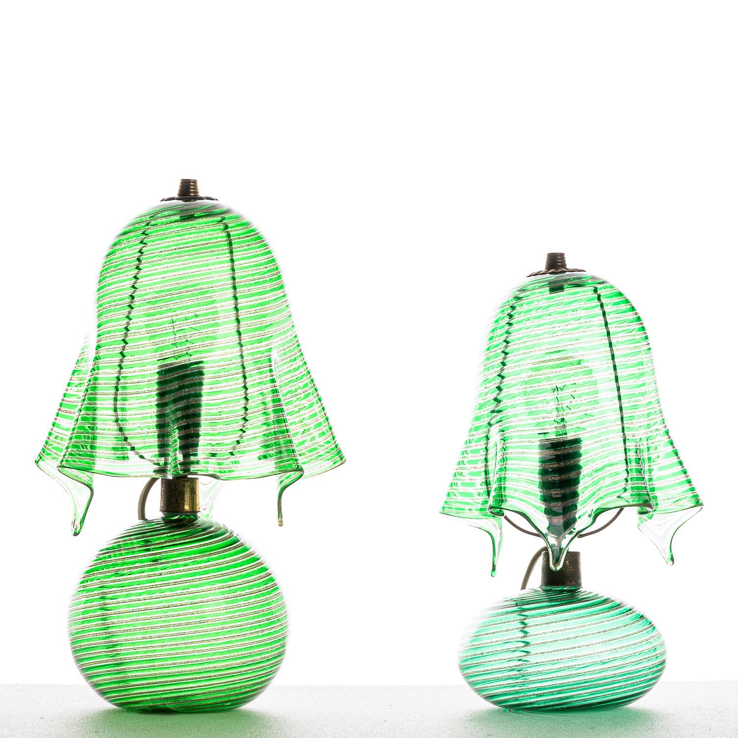 This incredible piece attributed to 1940s Italian designer, Aureliano Toso. Originally picked up from a shop in Italy, it was brought to Amsterdam and has recently been restored back to its best. With the flowing, sculpted glass shade in green, this