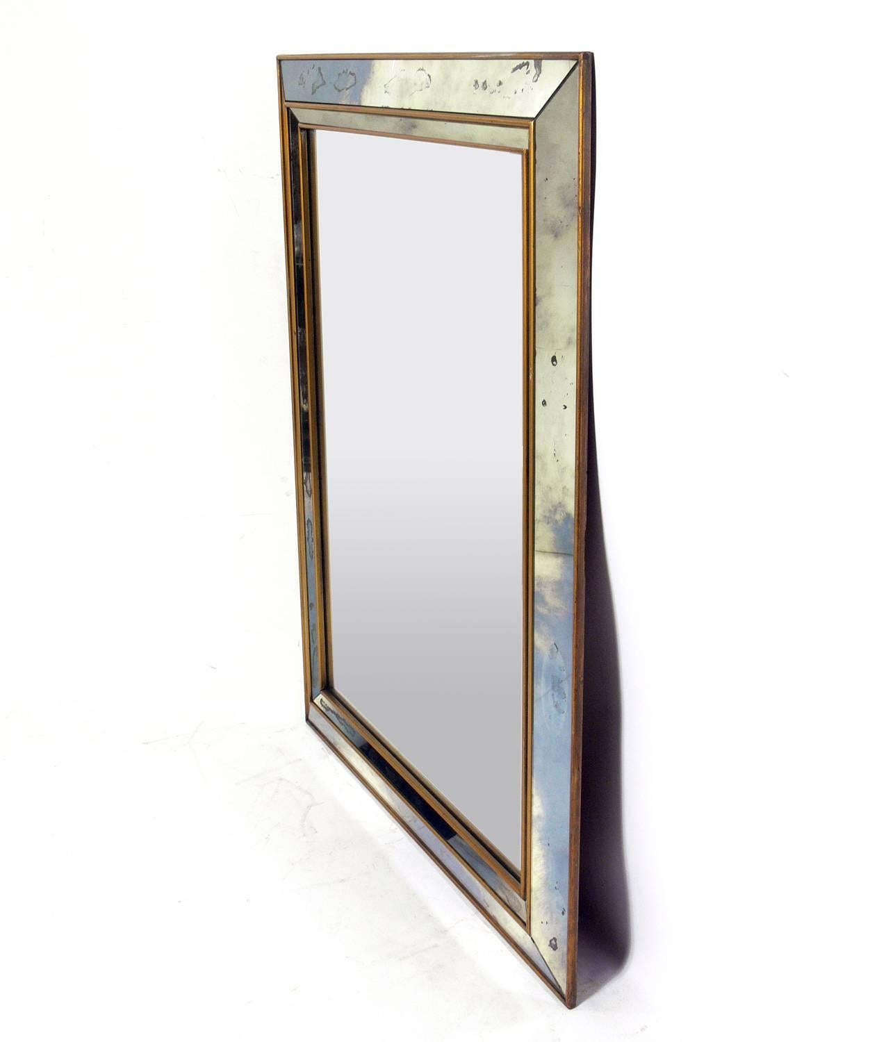 Gold and mirror framed mirror, American, circa 1940s. It retains it's warm patina throughout.