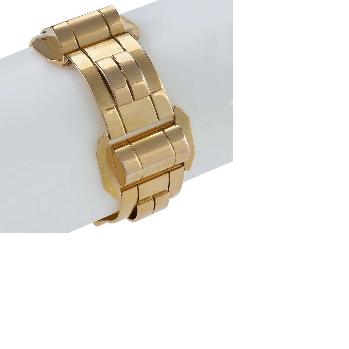 The highly polished geometry of this mid-20th century gold bracelet mesmerizes with its mirror-like surface and sleek minimalism. The repeating, architecturally-detailed motif of both horizontally- and vertically-oriented links is emblematic of the