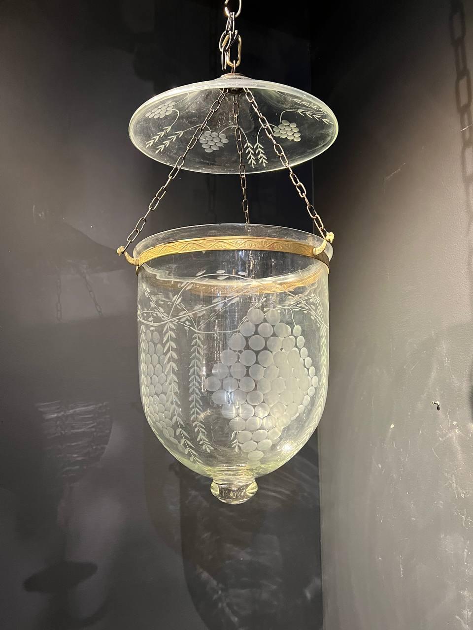 A circa 1940's glass lantern with grape design and three interior lights