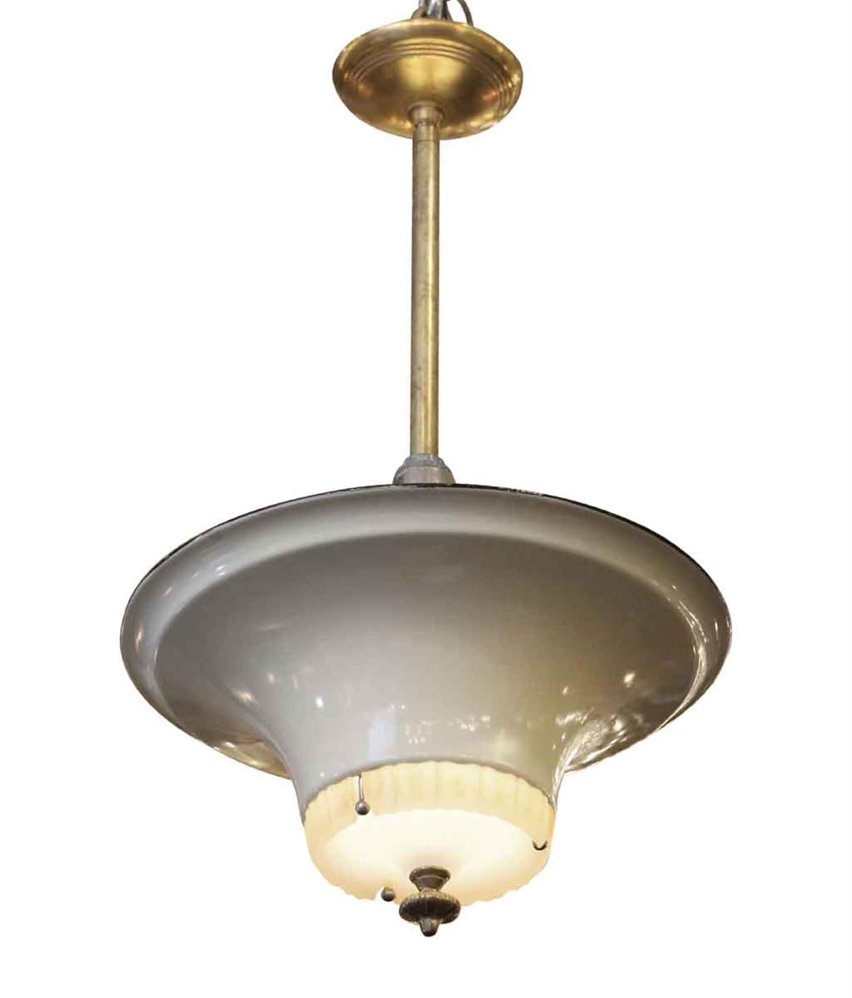 All original Jetson style 1940s gray enameled metal saucer light with a milk glass center and a brass finial, pole and canopy. This can be seen at our 302 Bowery location in Manhattan.