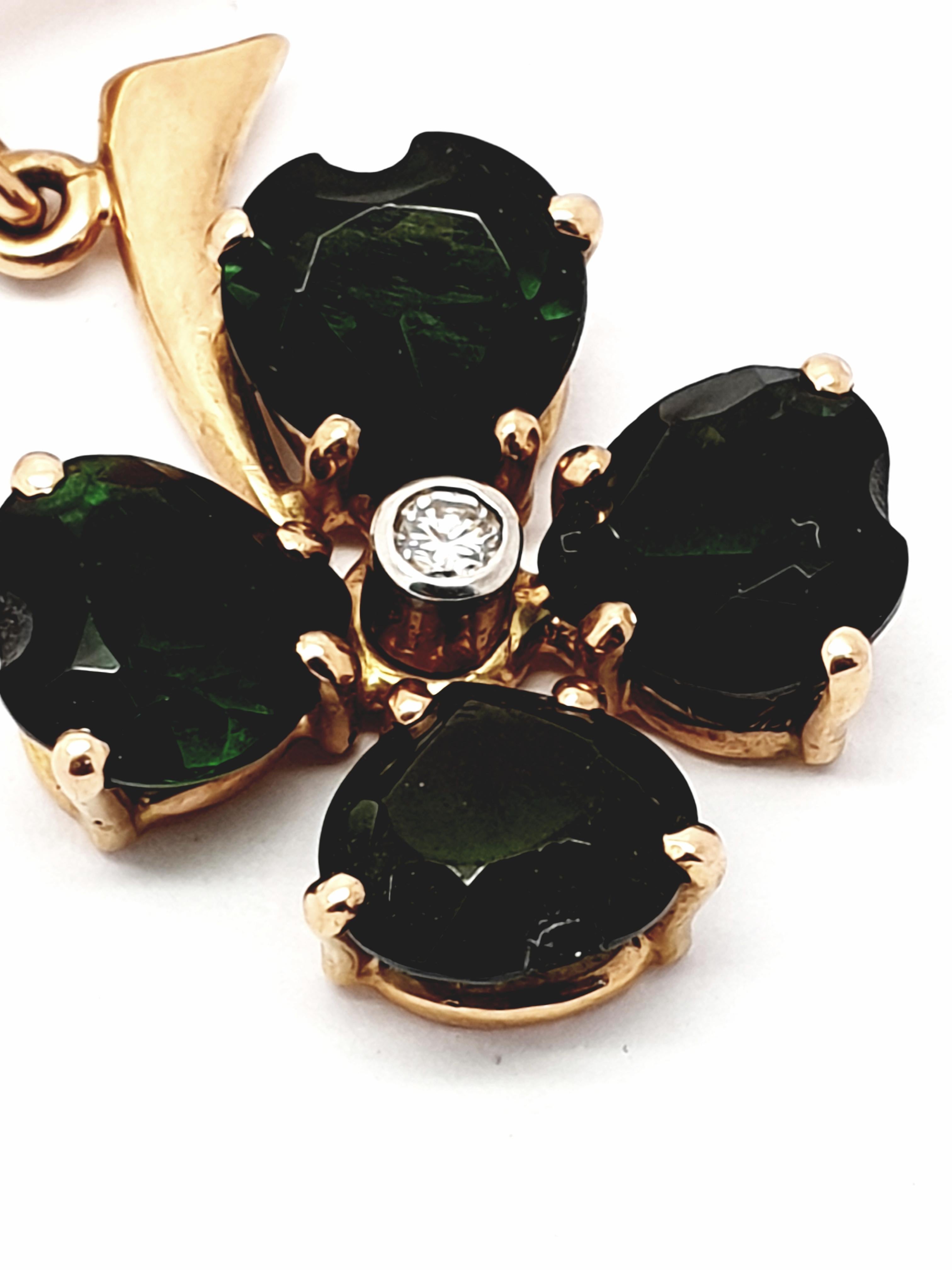 A  Beautiful 1940's 14 kt Gold Green Tourmaline Clover Shamrock ! Hand Crafted by a Master Art Jeweler ! Weighs approximately 5.4 grams. The setting and the  pin is 14 kt rose gold,hallmarked (see photos) . Green tourmaline stone leaves are carved