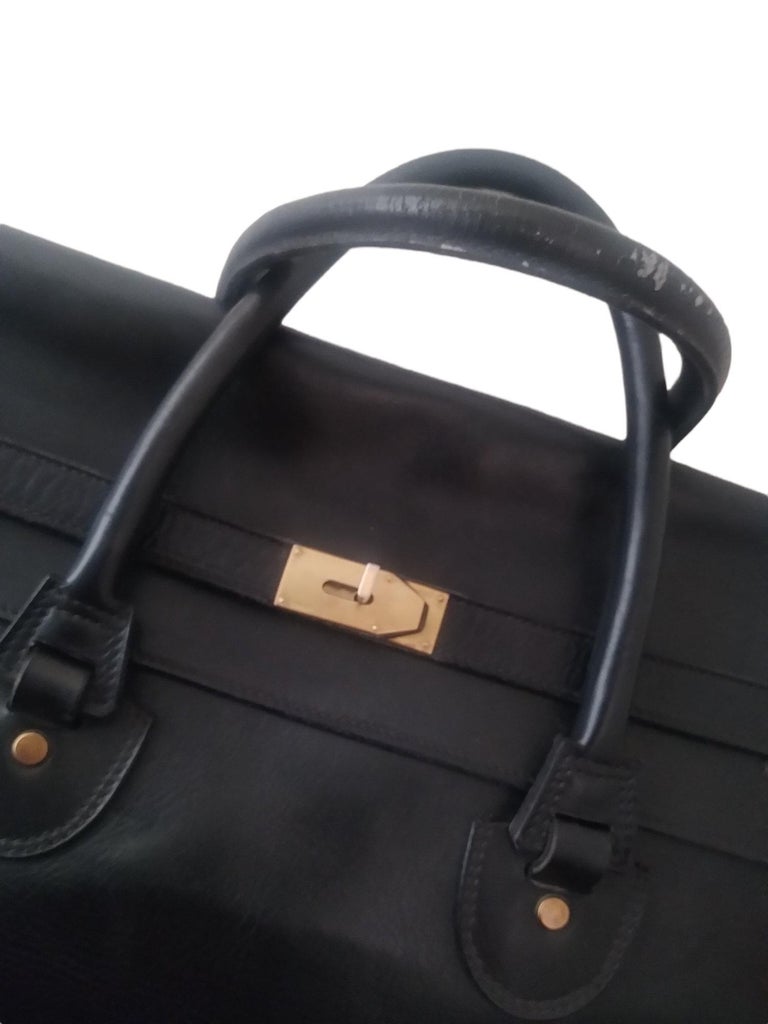 1940s Gucci Black Leather Large Birkin Style Travel Bag
- 100% authentic Gucci
- Black Leather
- Interior in red fabric. The fabric in this color was desired by the client who commissioned the bag
- Spacious interior with a zip opening pocket
-