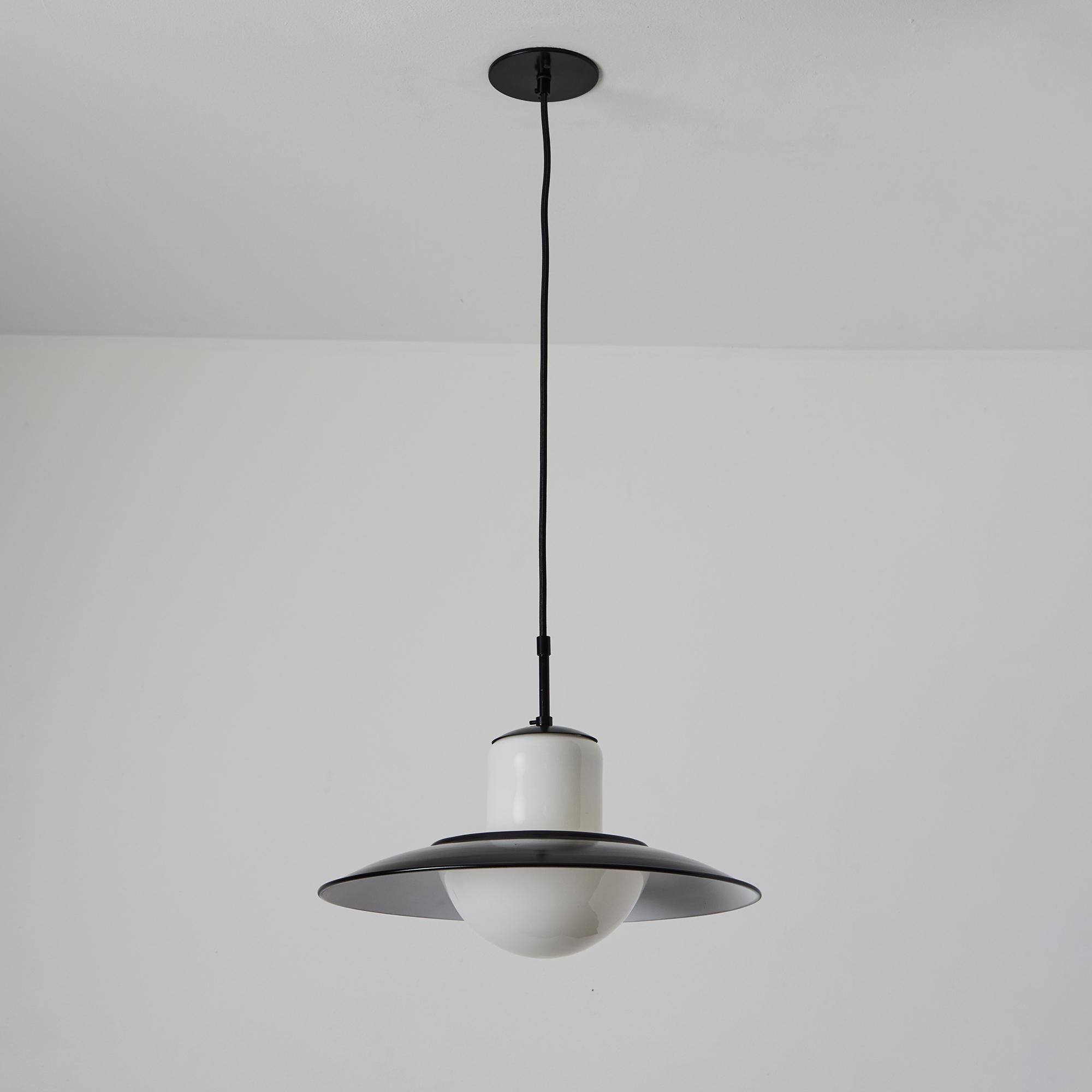1940s Gunilla Jung Model #1005 Glass & Metal Ceiling Lamp for Stockmann Orno. Executed in blown opaline glass with black painted metal hardware.

A contemporary of Paavo Tynell, the incredibly refined work of Gunilla Jung has become increasingly