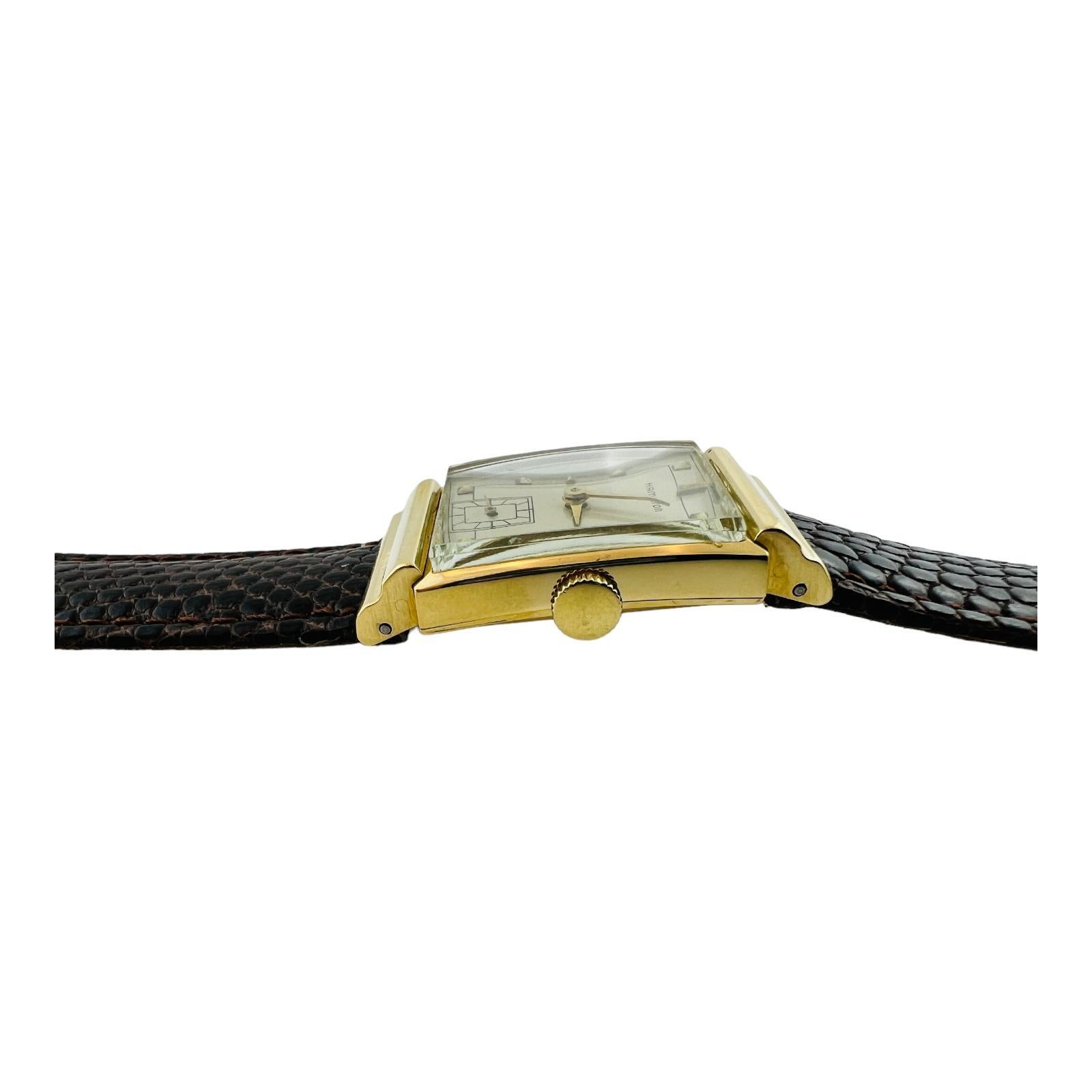 1940's Hamilton Gordon Men's Watch'

This vintage Hamilton men's watch is set in 18K yellow gold.

Case is approx. 22mm x 37mm

Hand winding movement

Silver Dial 

Gold pyramid hour markers

New brown leather lizard band - not Hamilton

Original