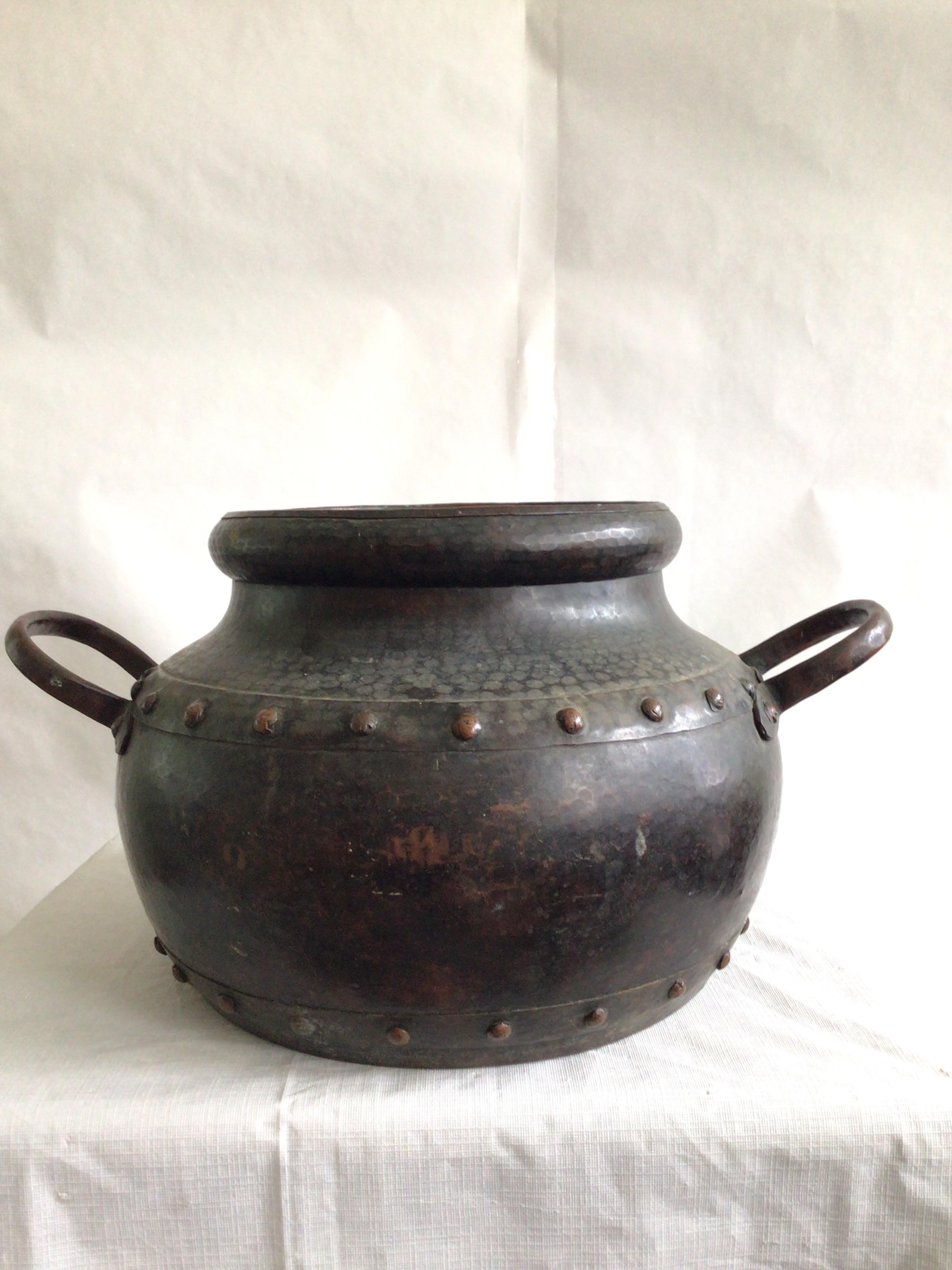 1940s Hand Hammered Studded Copper Pot With Handles
Beautiful patina and hammered finish 
