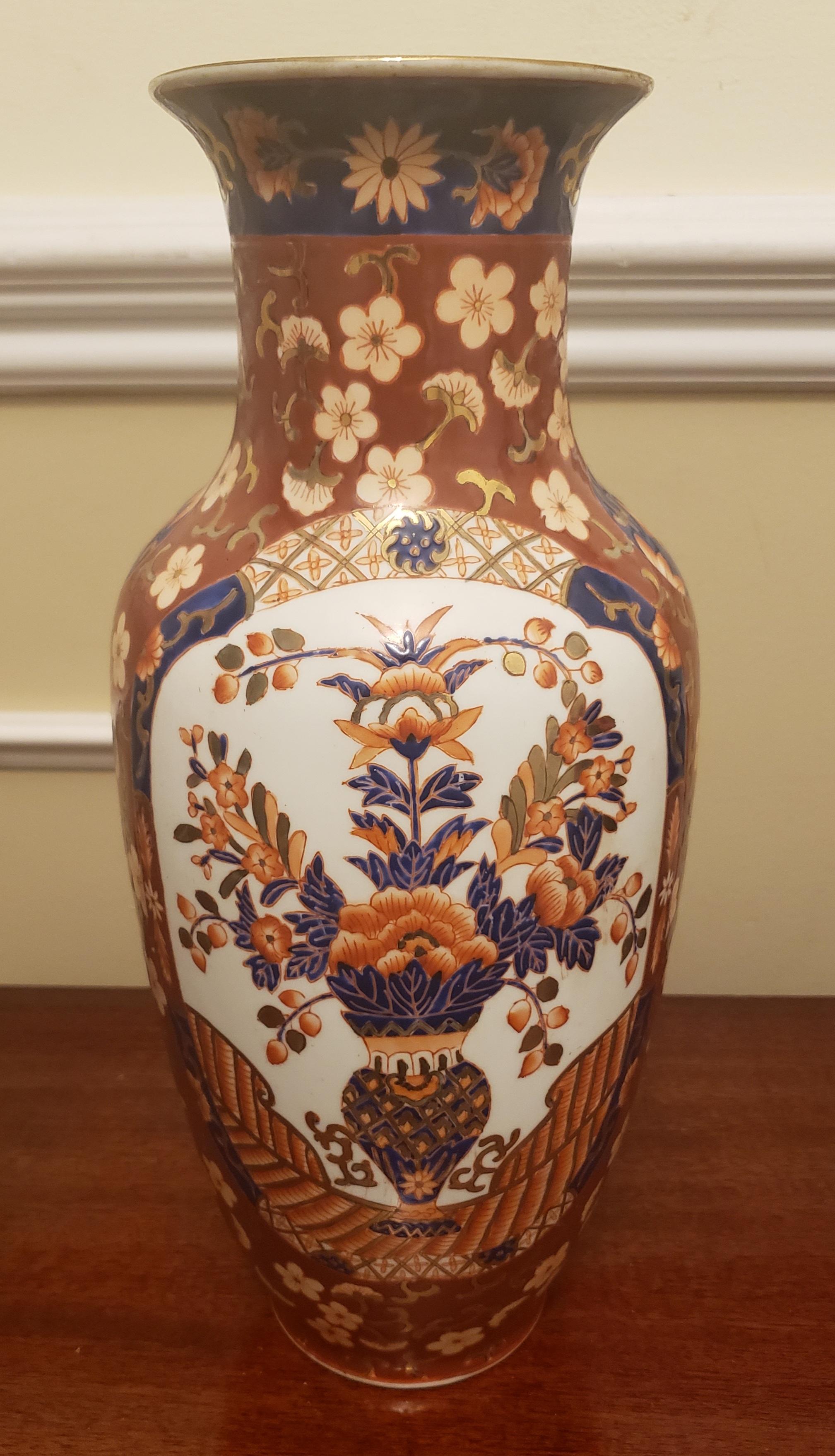 Early to mid- 20th century hand painted enameled porcelain vase. In excellent condition. 6”W x 14”H x 6” D at the widest point (4.5” at vase opening). In excellent condition for age and usage- no chips present. Traditionally hand made in Macau.