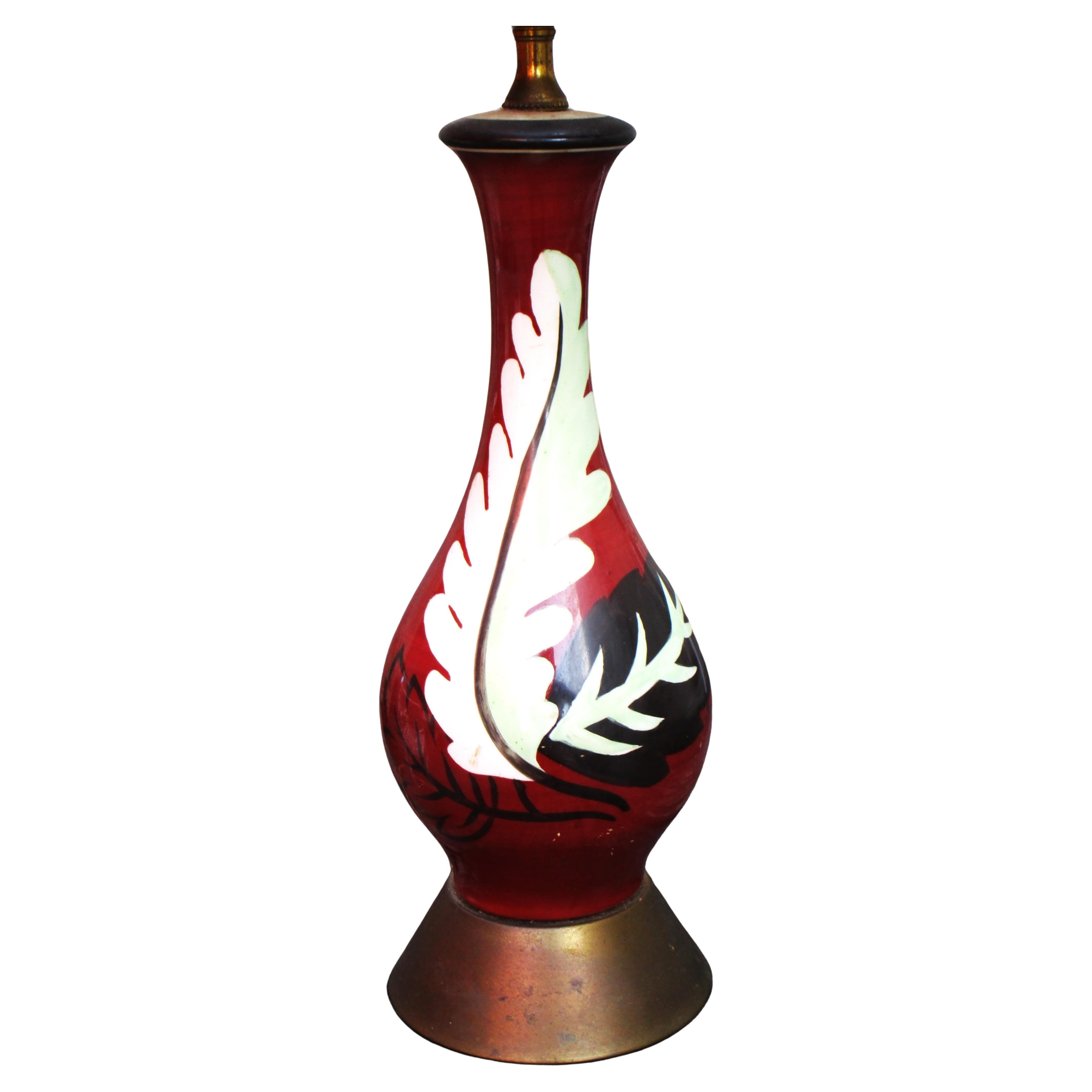 Hand painted porcelain table lamp w/ bold leaf decoration in the style of Henri Matisse. Signed Nadia, Circa 1940's. Measures  26