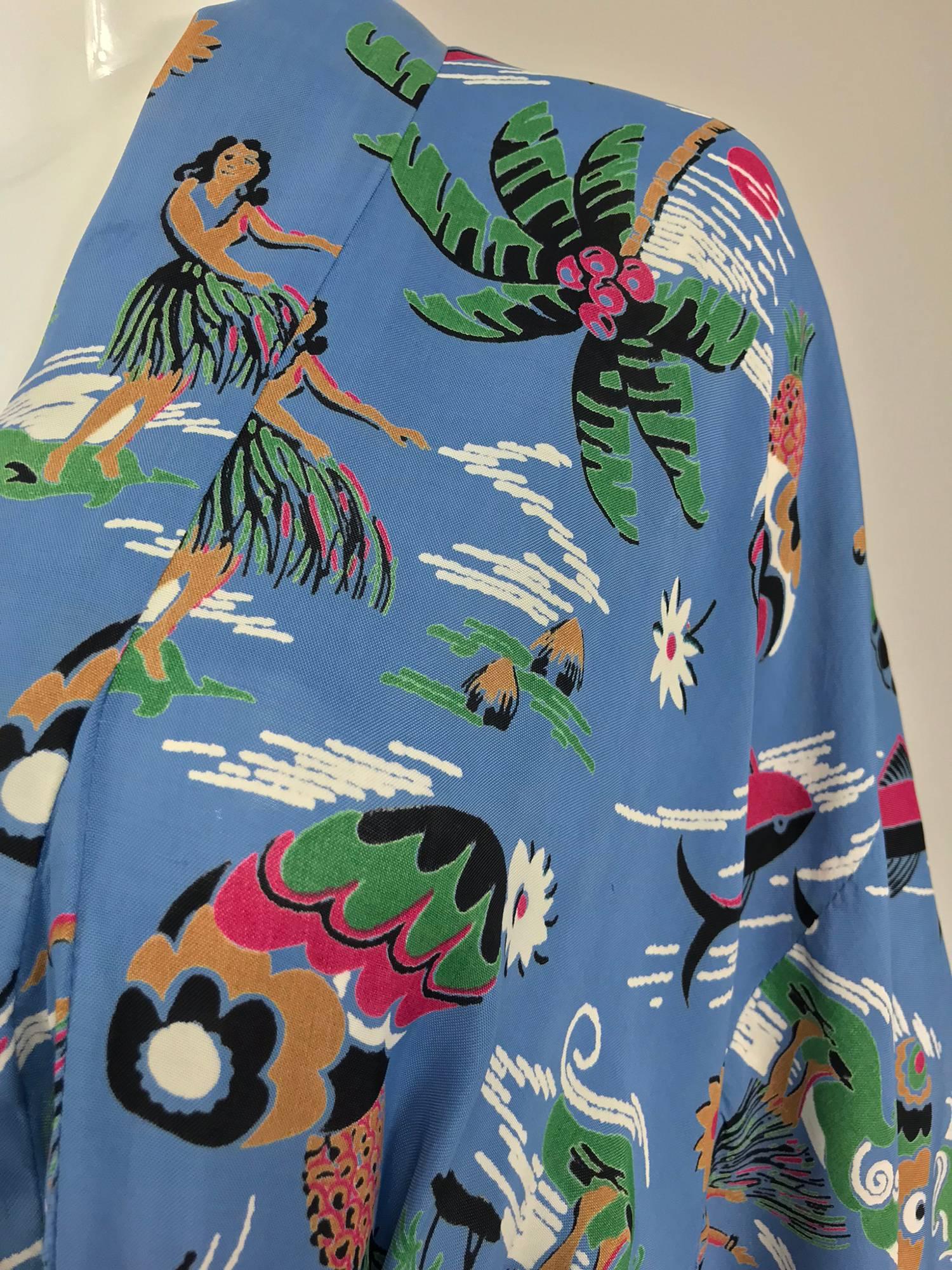 1940s Hawaiian novelty print kimono with hula girls, surfers and palm trees...This amazing kimono robe is a rare find these days!  It looks like it was professionally made, unfortunately, there is no label...Beautiful blue ground with brightly
