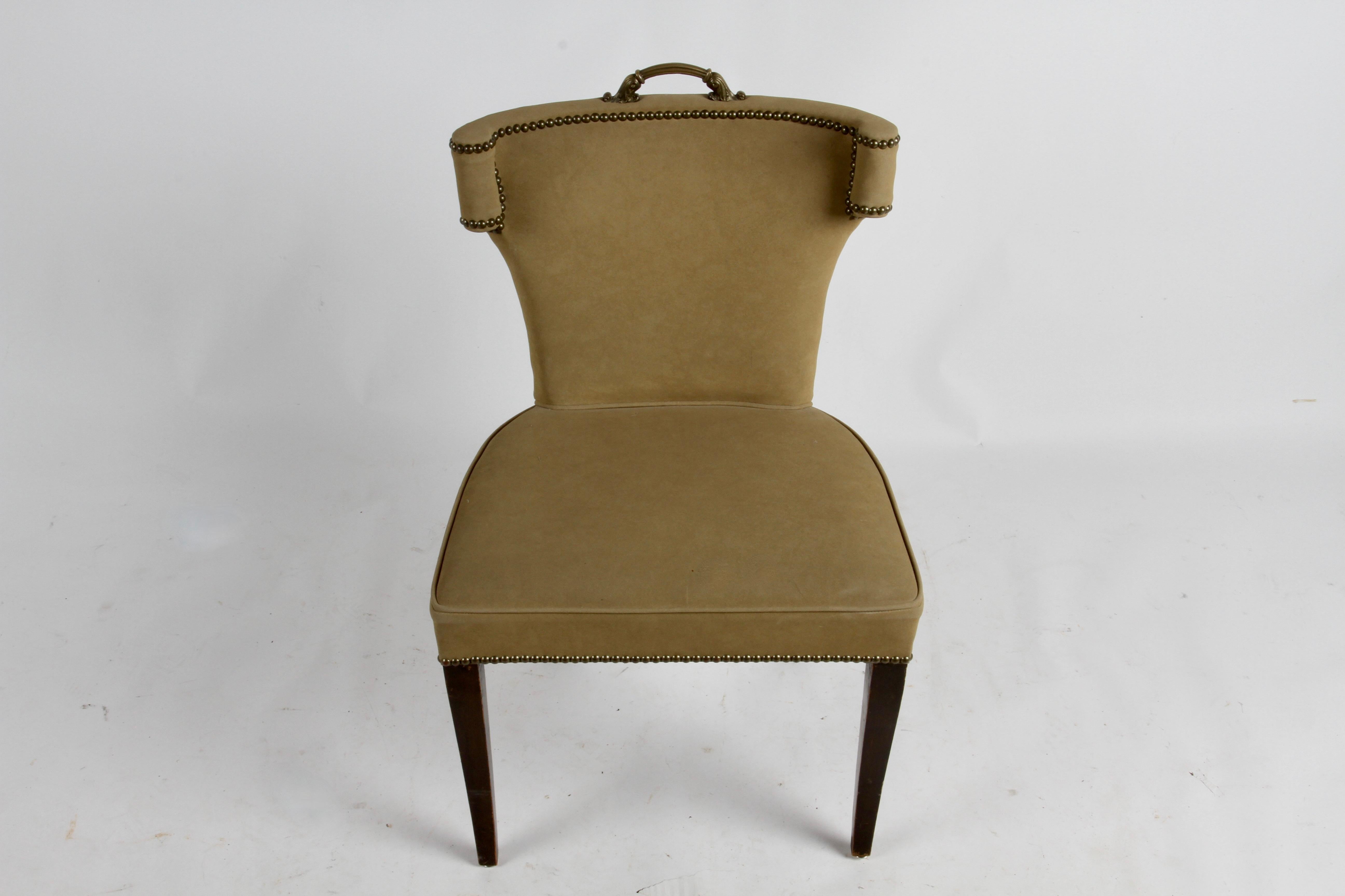 Hollywood Regency curved back splayed leg desk chair with brass handle, in the style of Grosfeld House. Older suede leather upholstery, brass tacks. Original finish to legs, shows wear to finish. Legs can be refinished, wear to upholstery.