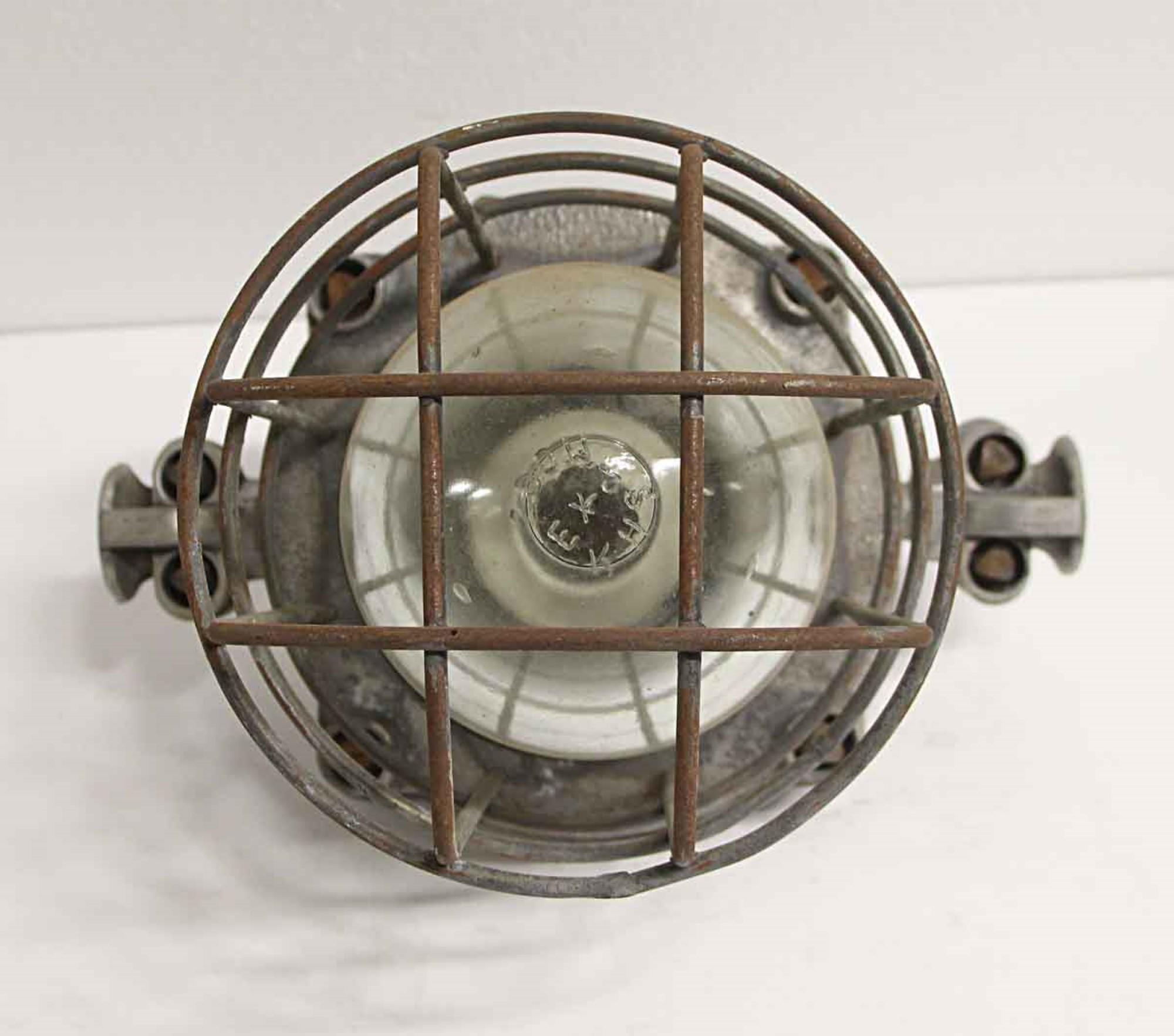 1940s nautical or Industrial style metal ship light with caged glass. Price includes restoration. This can be seen at our 400 Gilligan St location in Scranton. PA.