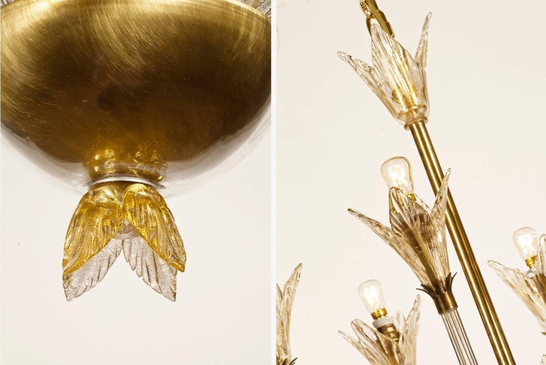 This 1940s inspired piece is handblown in exquisite Murano glass and each leaf is then individually bevelled and polished. A perfect marriage of design and craftsmanship.

Clear glass and clear and gold dust details on a satin gold frame.
8 x E14