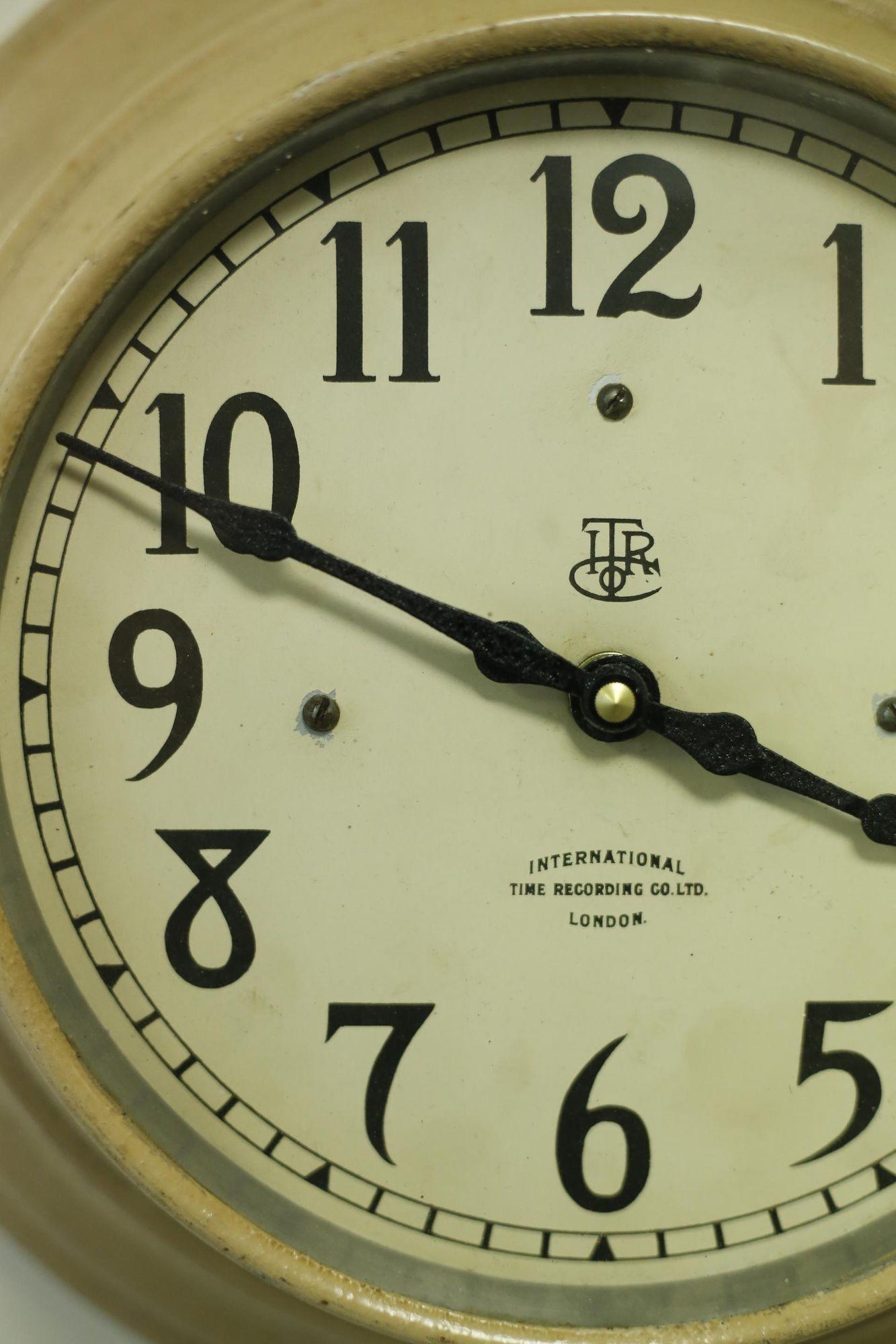 This is a very rare Factory wall clock by International time recording co. The case is stepped copper that retains the original painted finish. The dial is clean with great font used on the numbers. The clock has been converted to a battery powered