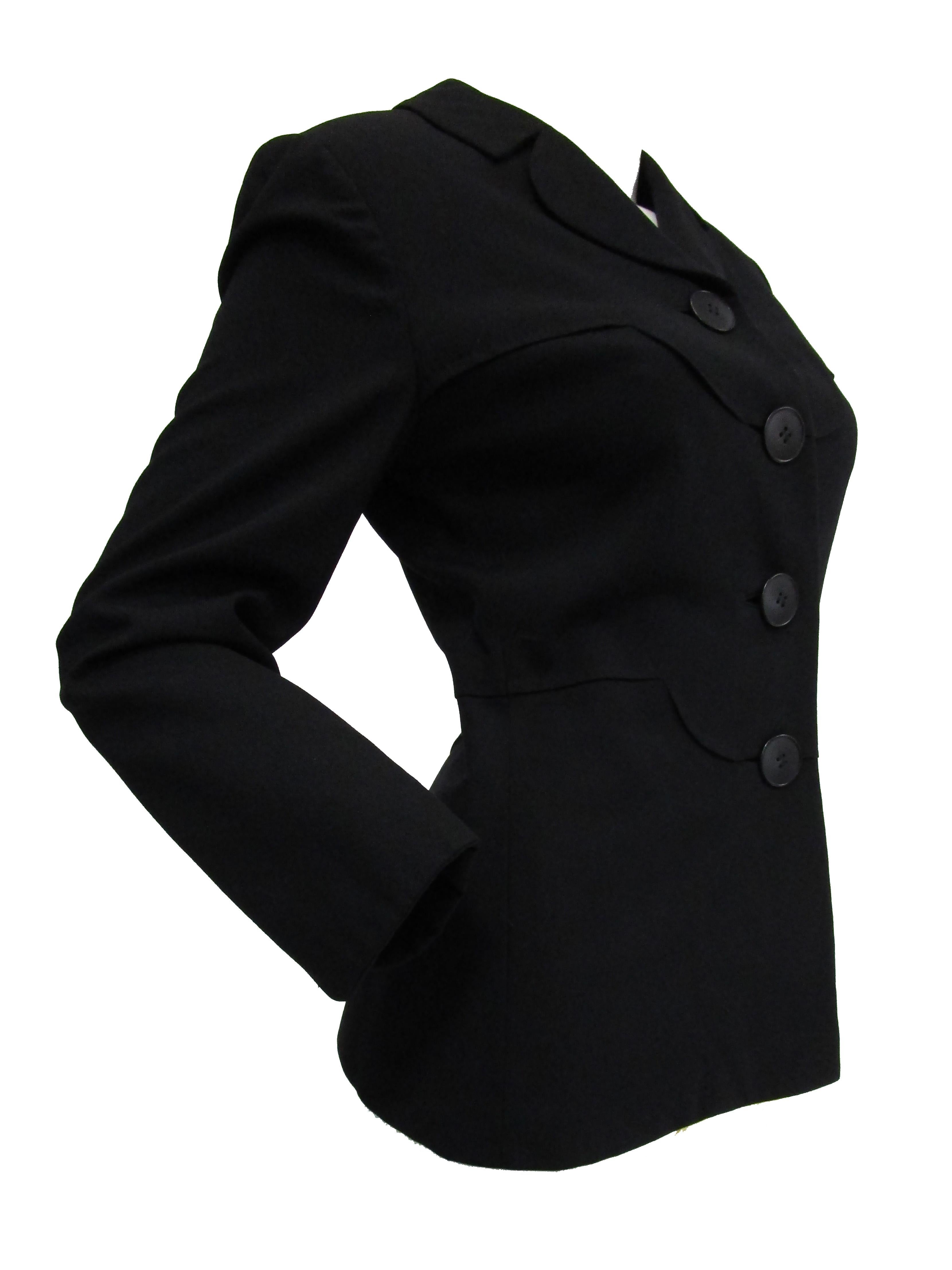 Incredible black wool blazer by Irene Lentz (also known as Irene Gibbons). The jacket is hip length, with long sleeves, a fitted silhouette, structured shoulders, and a high V - neck closure with a small, rounded, notched lapel. Four round oversized