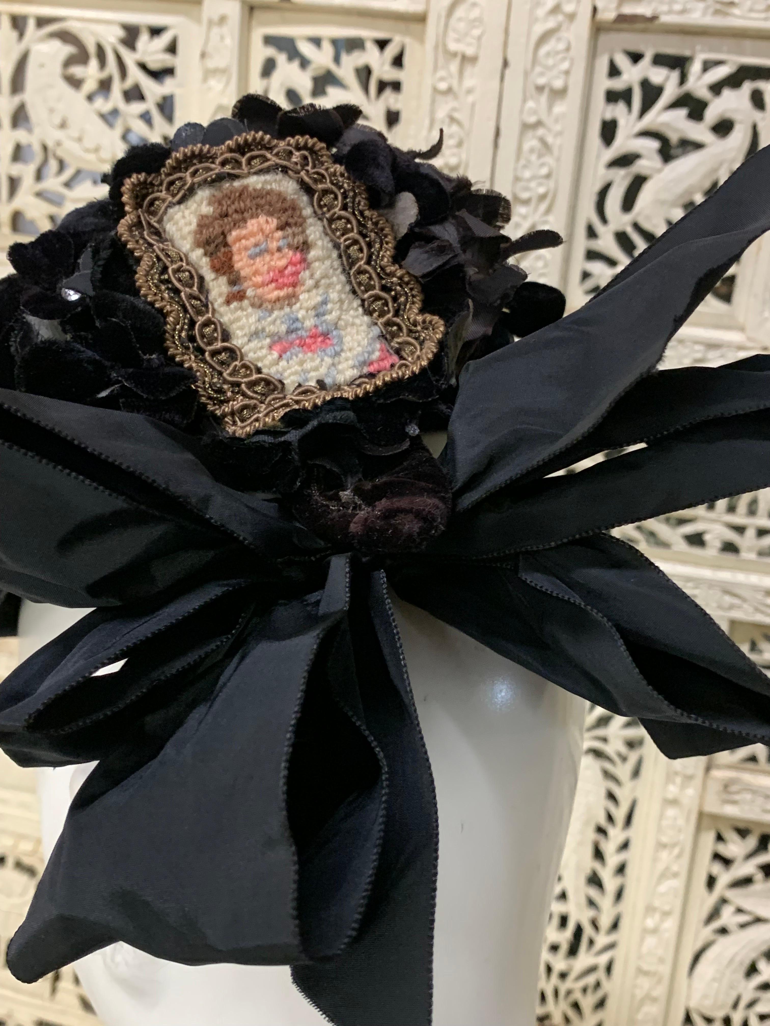 1940s Irina Roublon Couture Avant Garde Pillbox Shaped Velvet Hat w Trompe L'Oeil Needlepoint Portrait:  A true couture piece from a stellar milliner. This unique piece features a framed miniature portrait entirely made of needlepoint at back with 