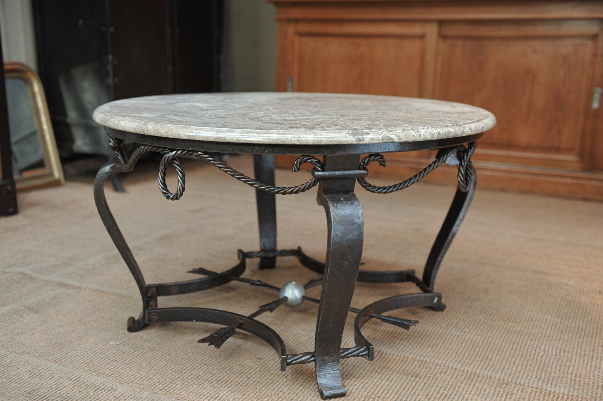 Great quality heavy iron base with it's original marble-top coffee table all in excellent condition.
 