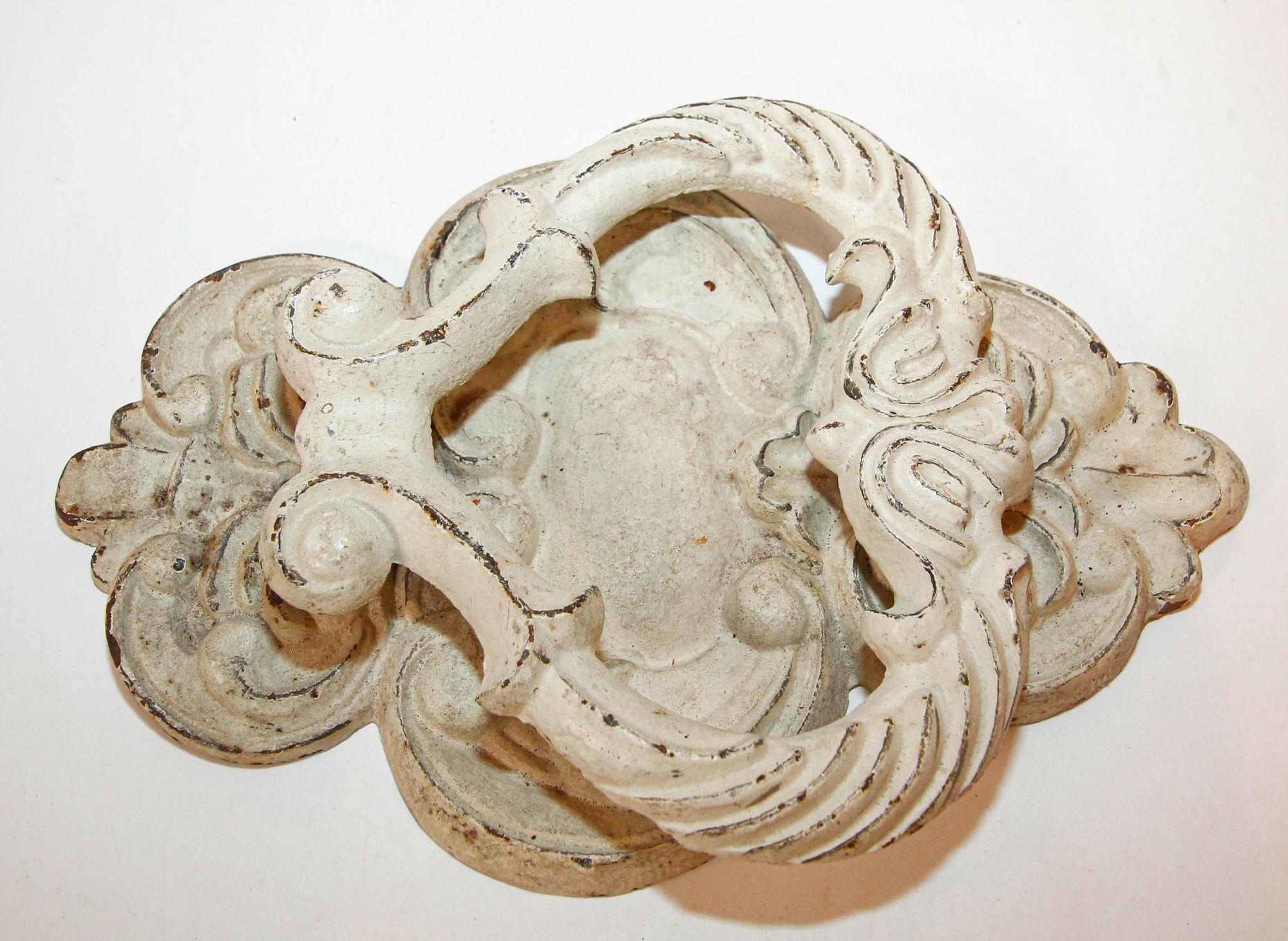 Italian Antique White Cast Iron Door Knocker.
Large antique ornate white metal cast iron, shabby chic Italian style.
Large and heavy 1940s very ornate Rococo style cast iron large door knocker.
Dimensions: 10.25 in. H. x 6.75 in.W. X 1.5 in.D.