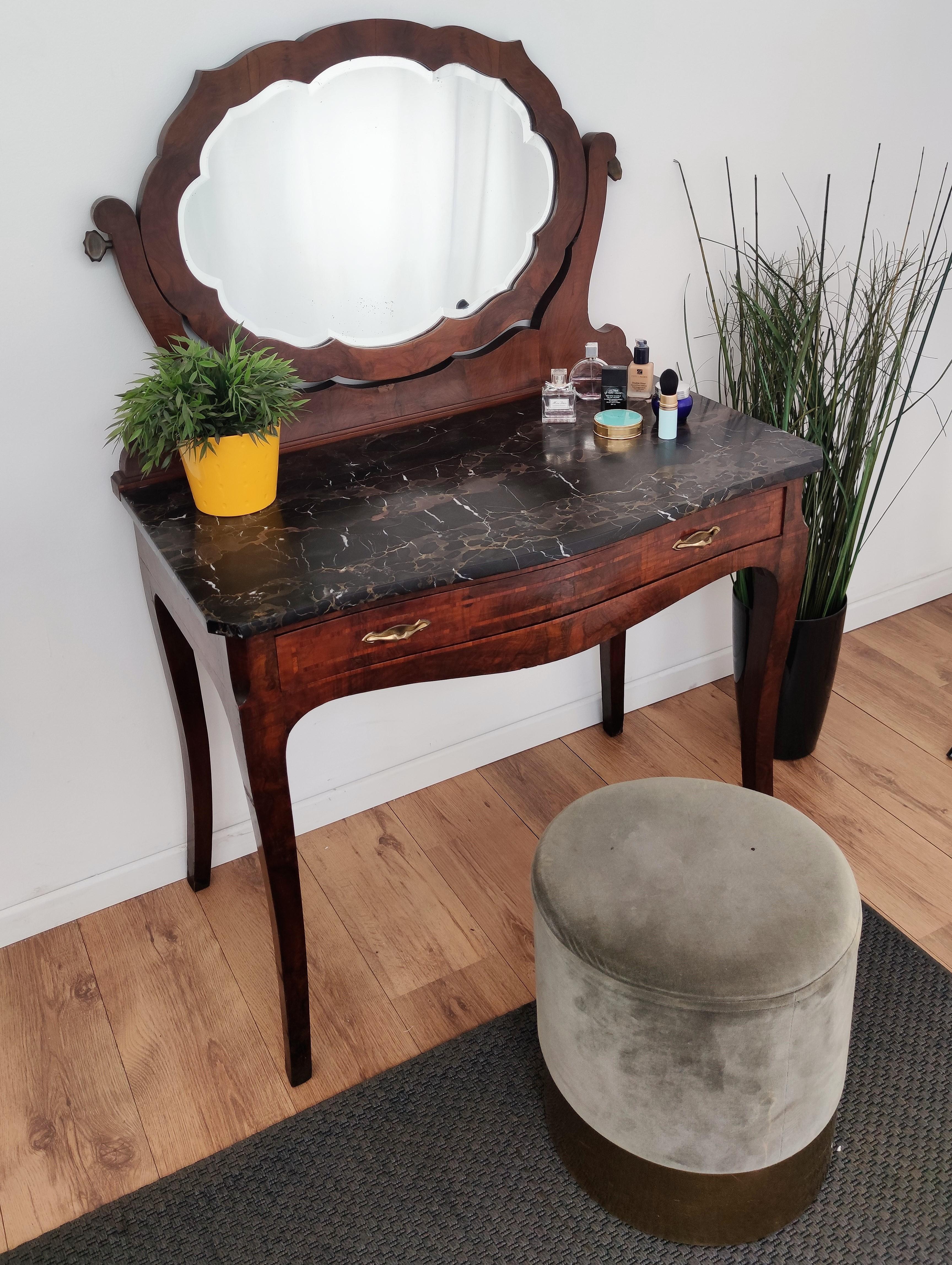 Beautiful Italian Art Deco mid-century vanity or dressing table with amazing Portoro marble top, a cretaceous golden veined black marble from the region of La Spezia, right north of Carrara, and a beautifully shaped, tilting and beveled, mirror. The