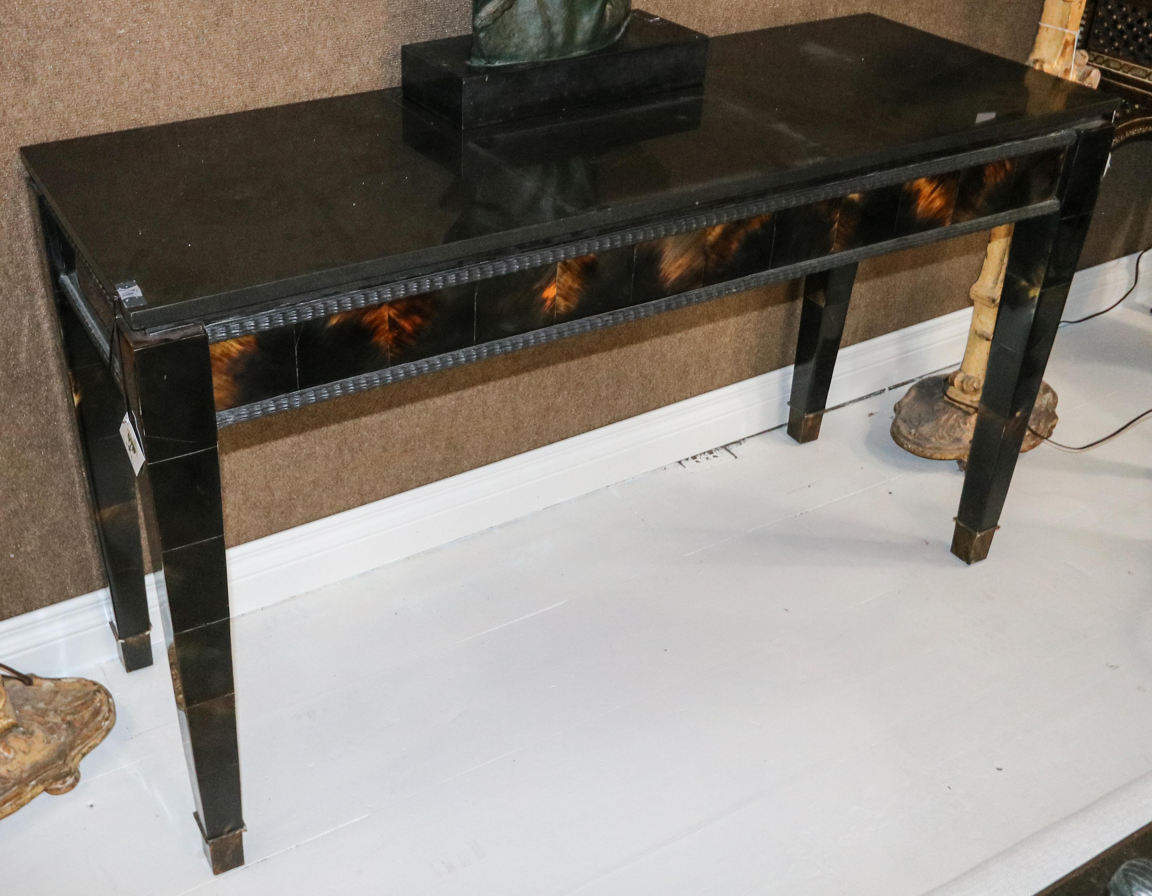 1940s Italian black lacquer console table with horn detail on the front and a black marble top.