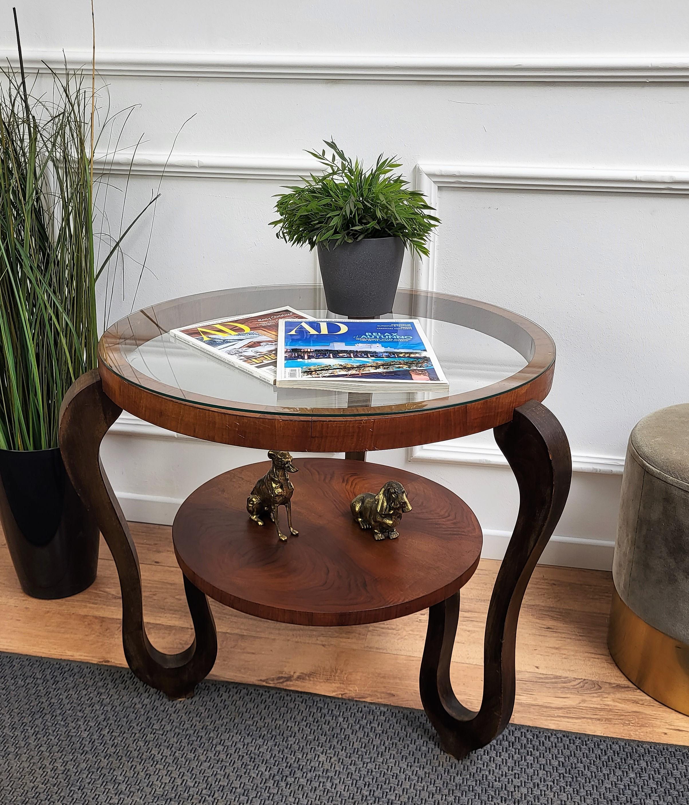 Round and very decorative Art Deco wood and glass center table or coffee table, manufactured in the 1940s in Italy. The conditions are excellent, with very minor fading and great timeless patina. A great piece that perfectly adds to every home decor