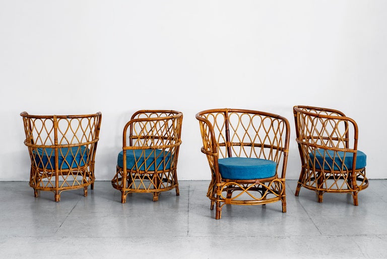 Set of four caned armchairs, circa 1940s by Lio Carminati 
Wonderful curved shape with original blue linen upholstered seats
Home & Garden Production - 1940s.

 