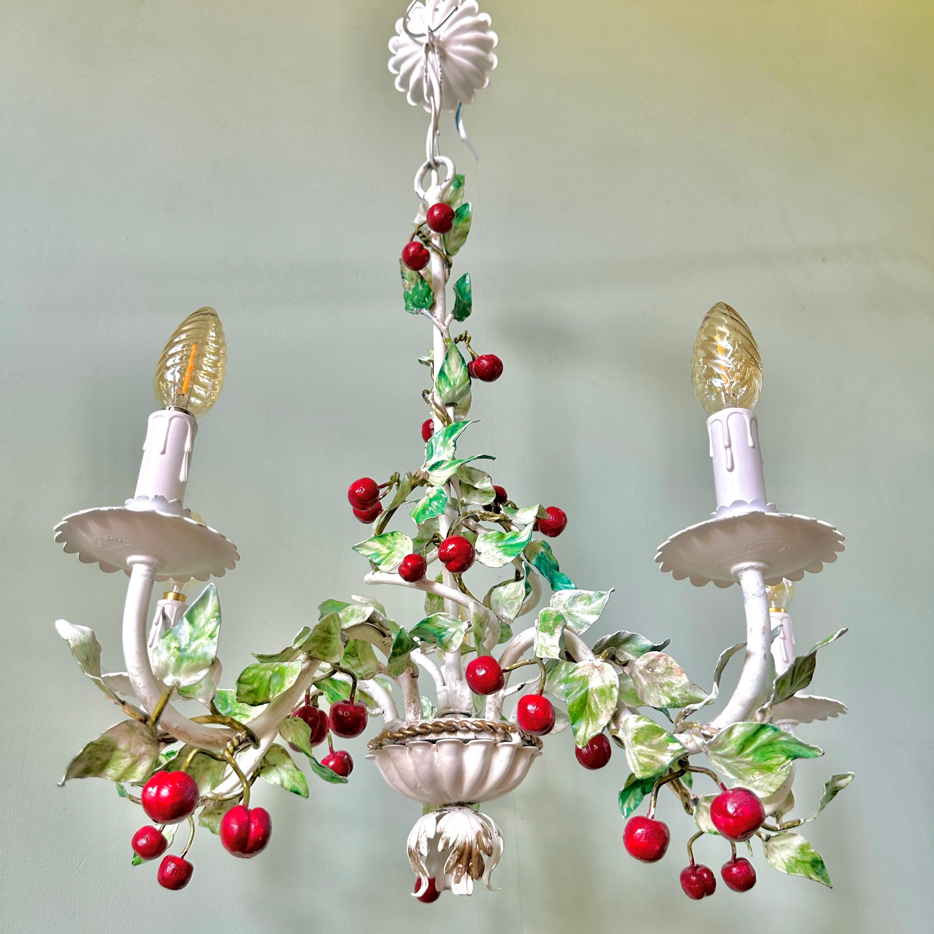 1940s Italian cherry toleware chandelier (1 of 2 available).

Gorgeous hand-painted, five-arm light with scalloped 'drip trays' and decorative base. In very good condition with some light and desirable wear. The chandelier has been rewired, fitted