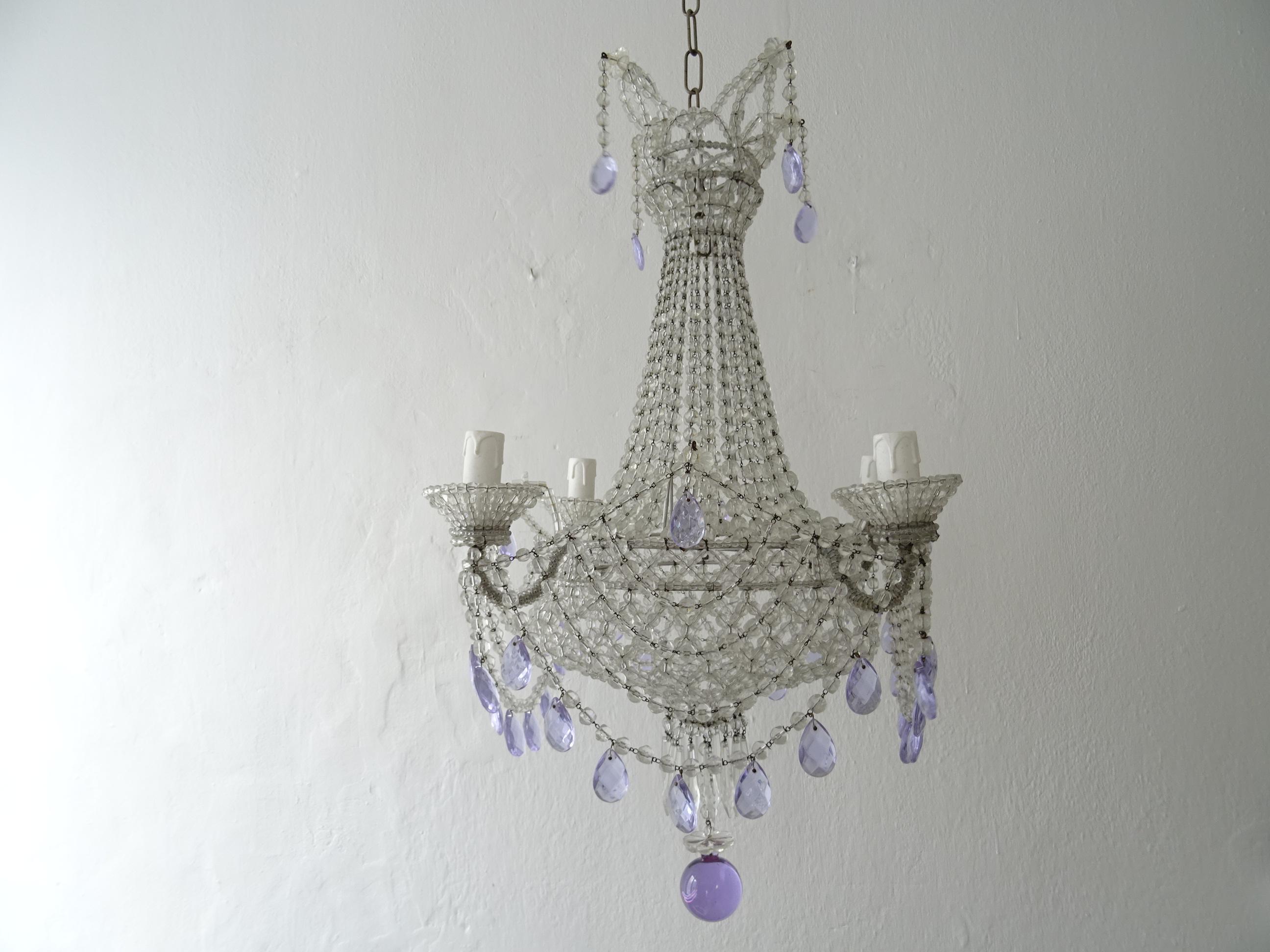 Housing 4 lights in beaded cups. Completely beaded with a beaded lace bottom. Adorning rare lavender purple crystal prisms throughout and huge smooth lavender matching ball as finial. Adding another 16 inches of original chain and canopy. Will be